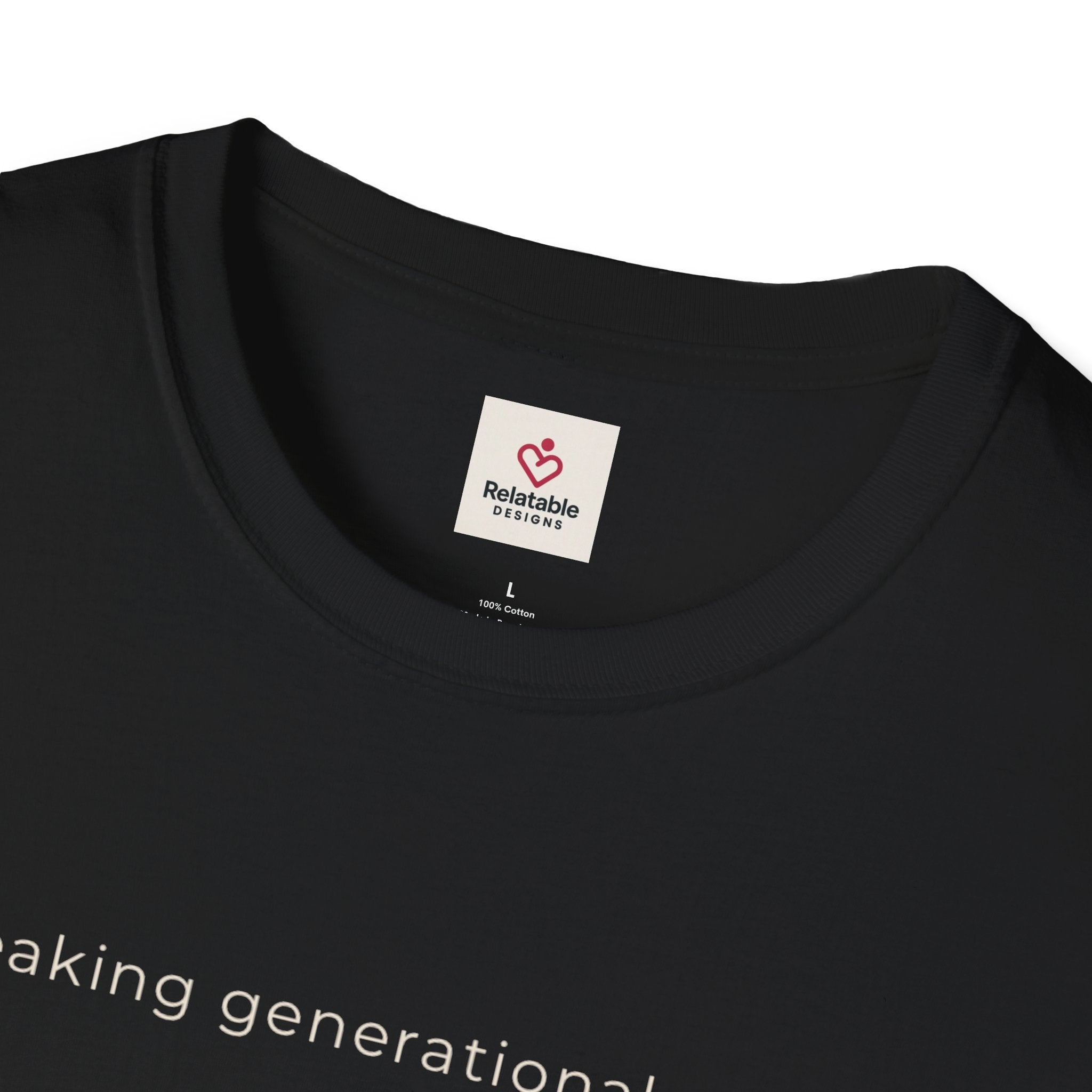 Close up of black t-shirt with 'Relatable Designs' label for breaking generational curses on a white background