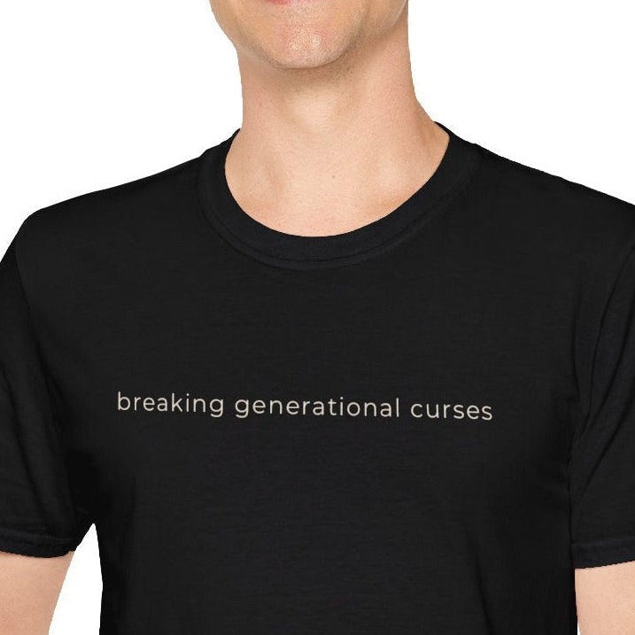 Man wearing a black t-shirt with text 'breaking generational curses' on a white background