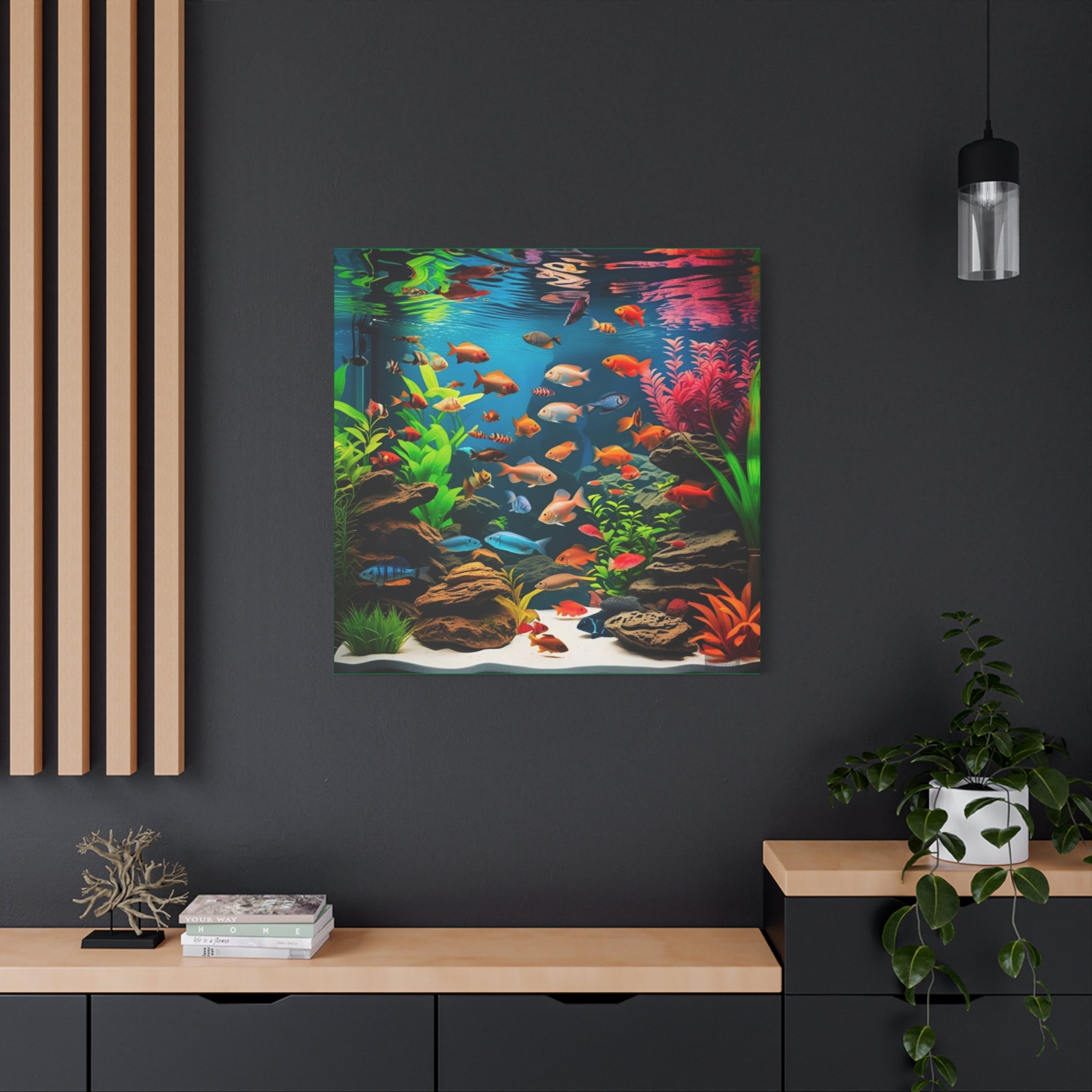 Framed artwork of an aquarium scene with fish and plants on a dark wall.