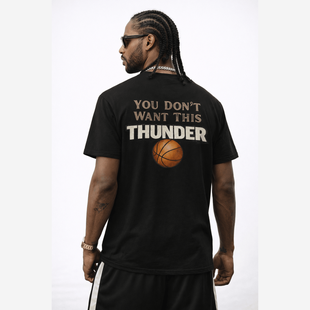 Man wearing a black t-shirt with text and a basketball graphic on the back of t-shirt, on a white background