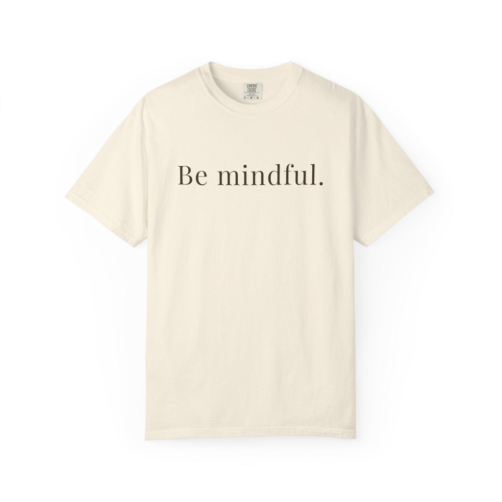 Beige t-shirt with 'Be mindful.' text on a white background