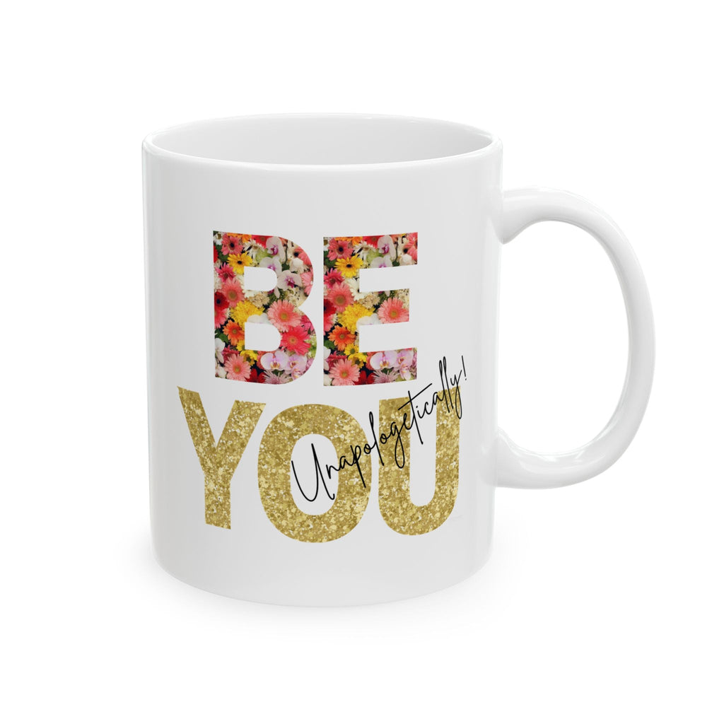 White ceramic mug with floral 'BE' and gold 'You' text on a white background by Relatable Designs. Left view.