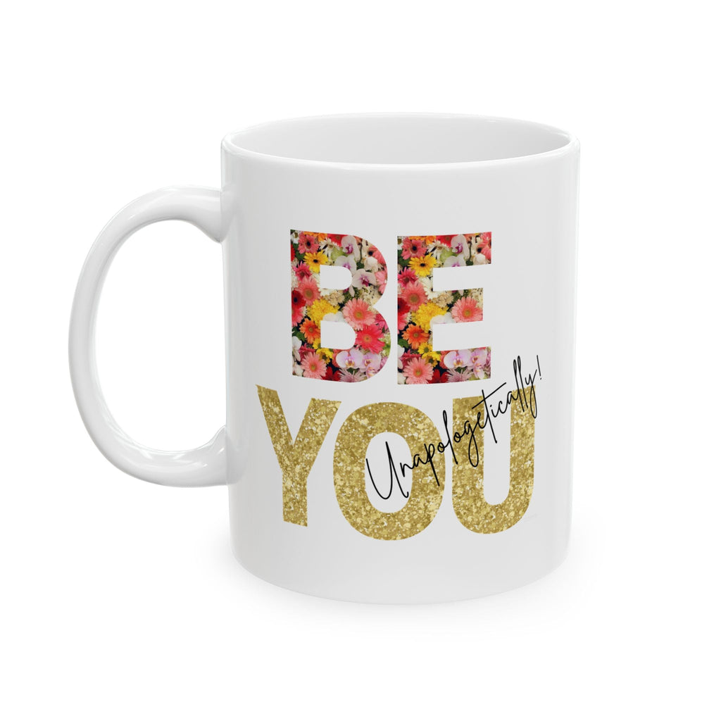 White ceramic mug with floral and gold elegant 'BE You' text on a white background. Left view.