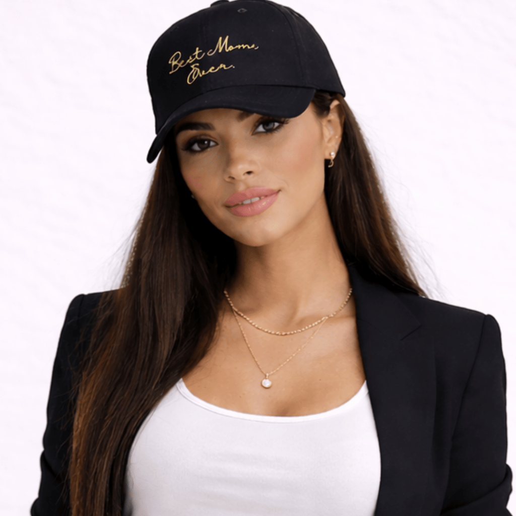 Woman wearing a black cap with 'Best Mom Ever' text, black blazer, and white top on a white background by Relatable Designs