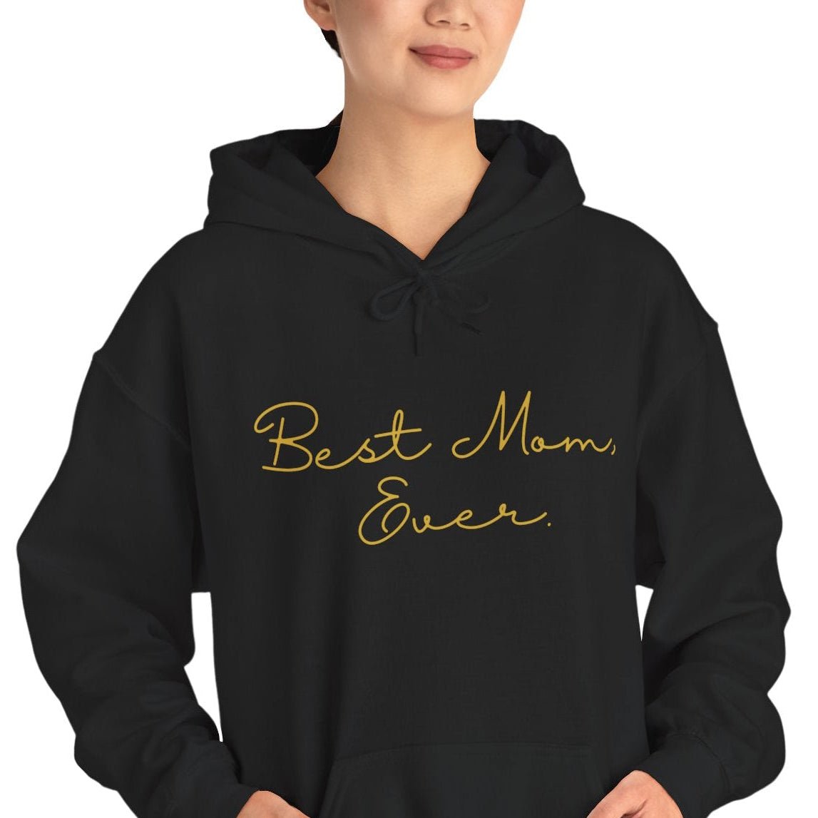 Woman wearing Black hoodie with 'Best Mom Ever' text in gold on a white background