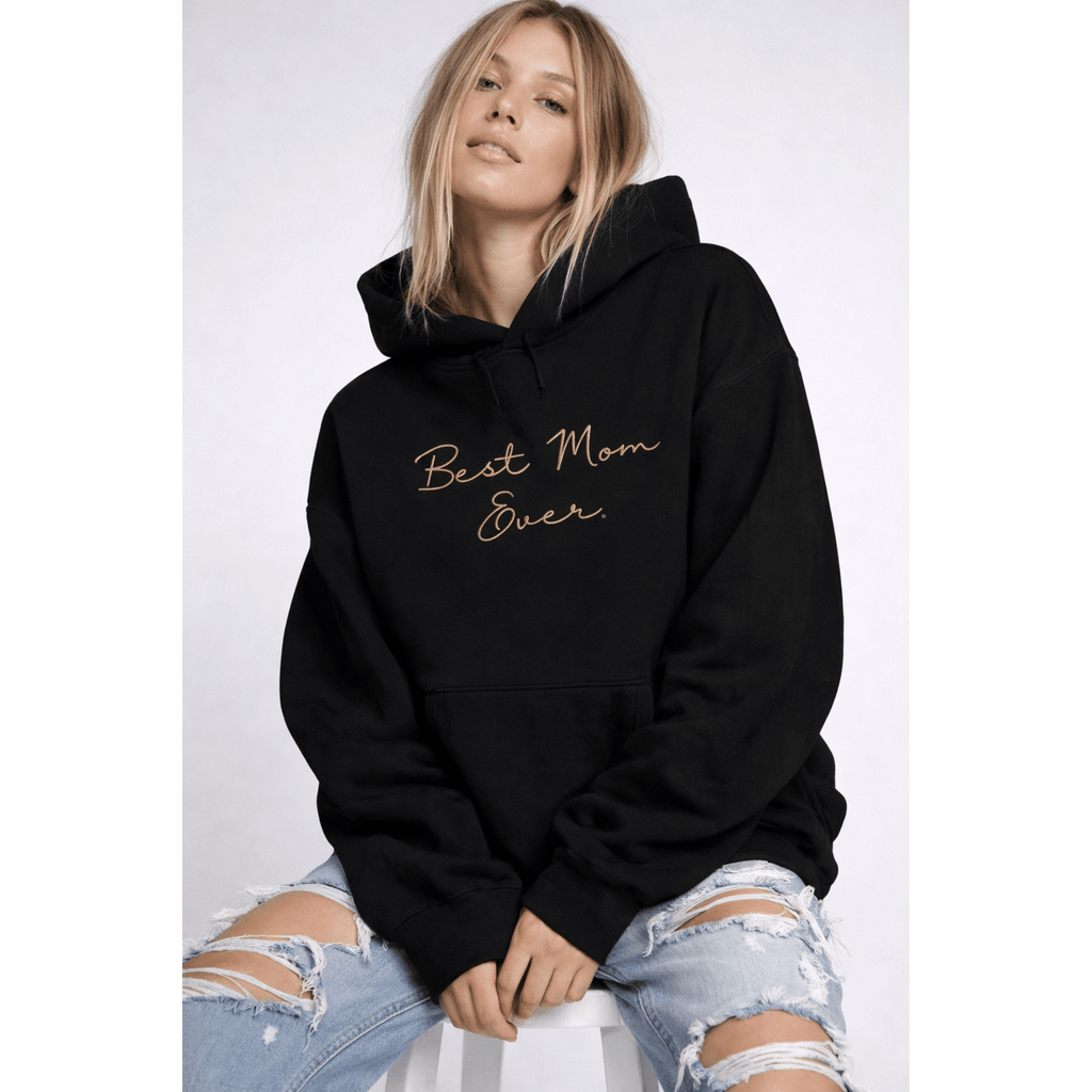 Female model wearing a black hoodie with 'Best Mom Ever' text on a white background