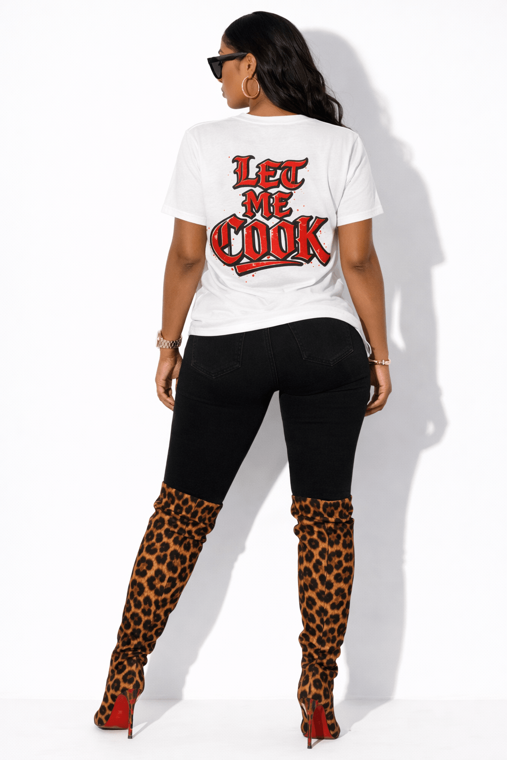 White graphic t-shirt back view – "Let Me Cook" bold statement tee styled with modern outfit fashion mock-up