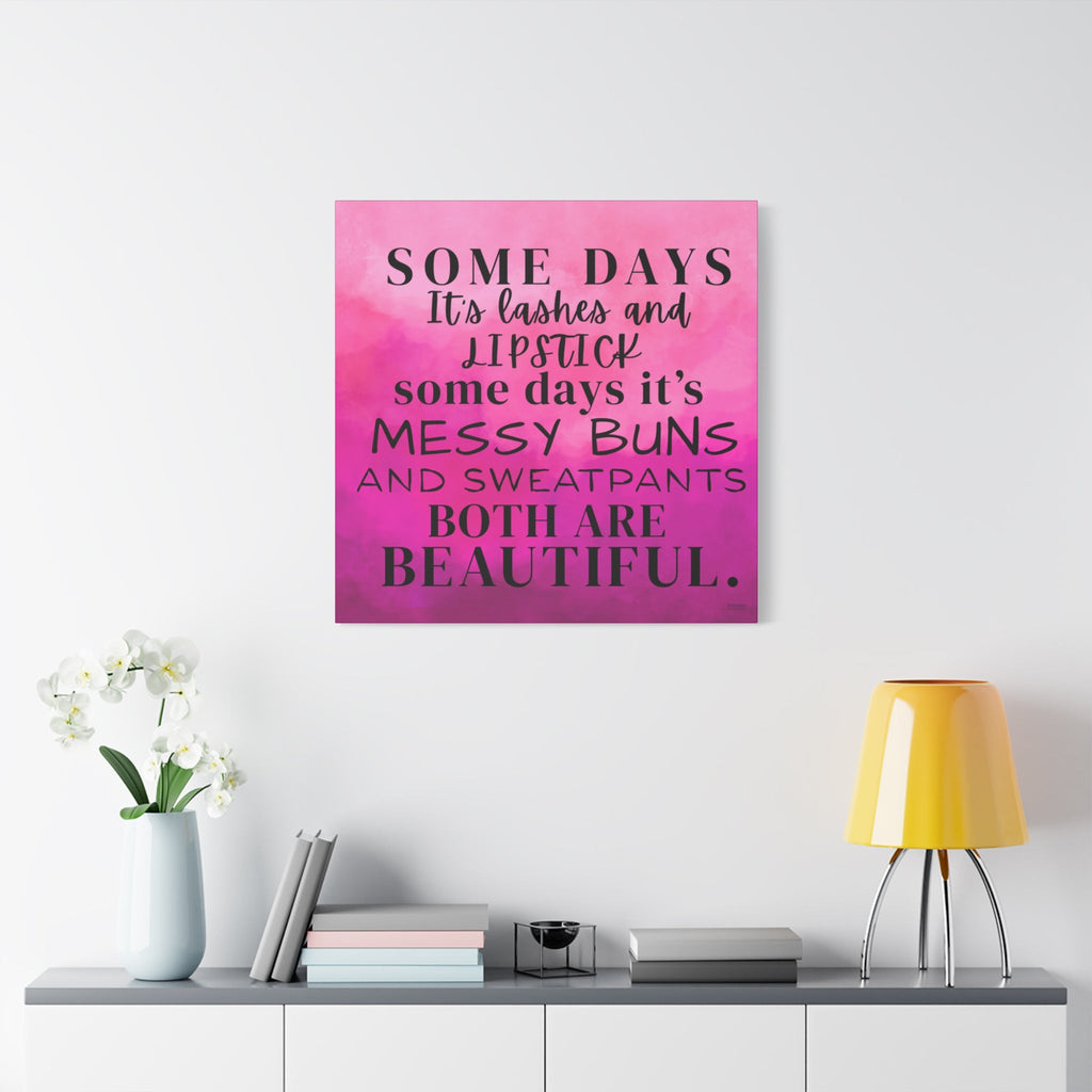 Canvas print with motivational quote on a pink and purple gradient background, displayed on a wall above a shelf.