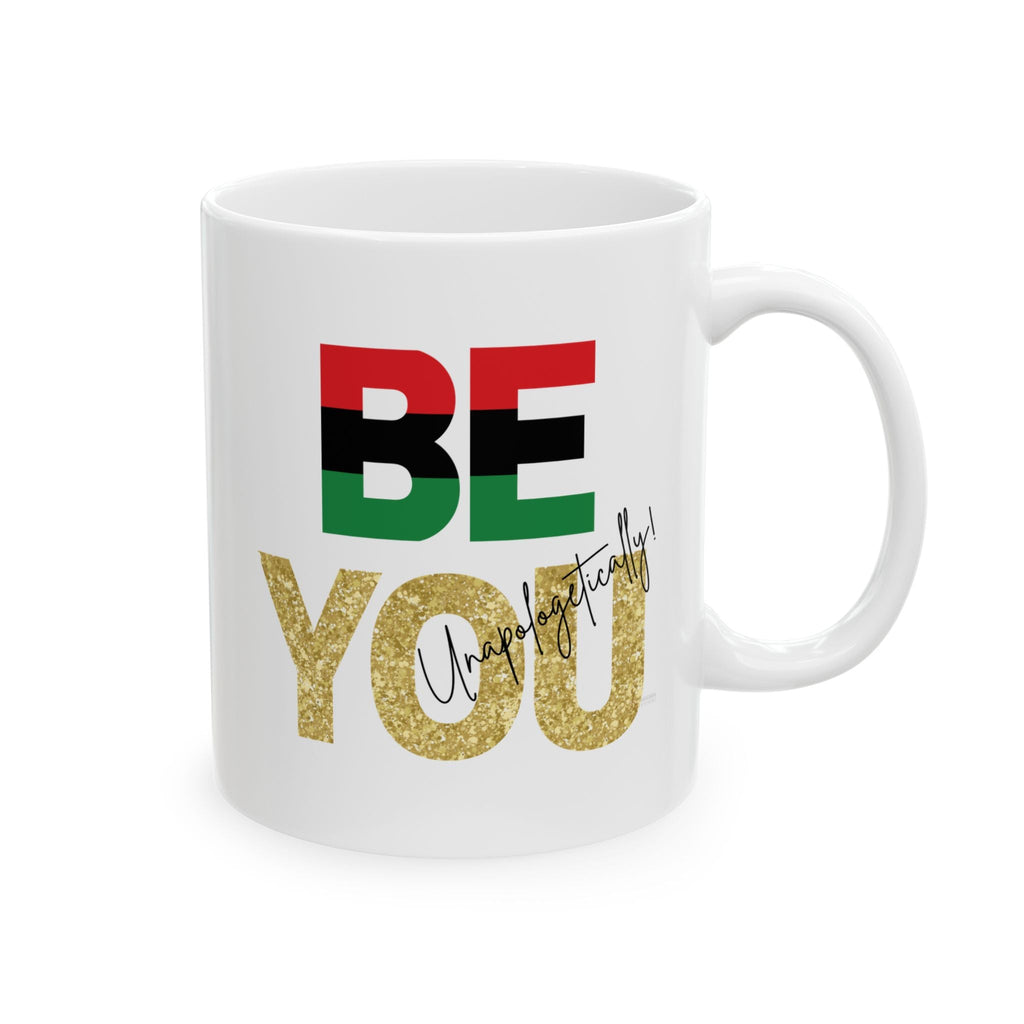 White mug with 'BE YOU Unapologetically' text in red, green, black, and gold lettering on a white background by Relatable Designs