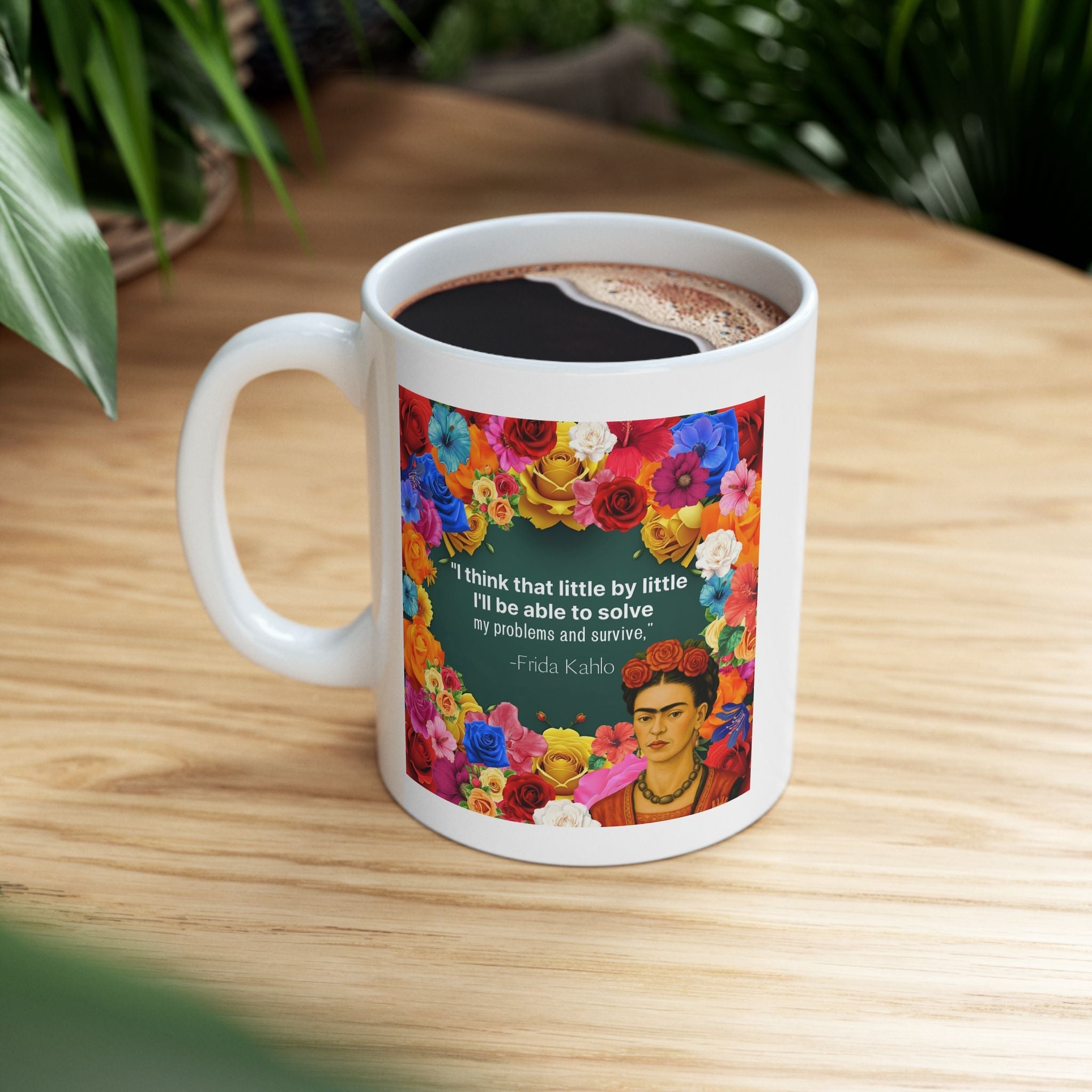 Mug with Frida Kahlo colorful design and floral pattern on a wooden surface