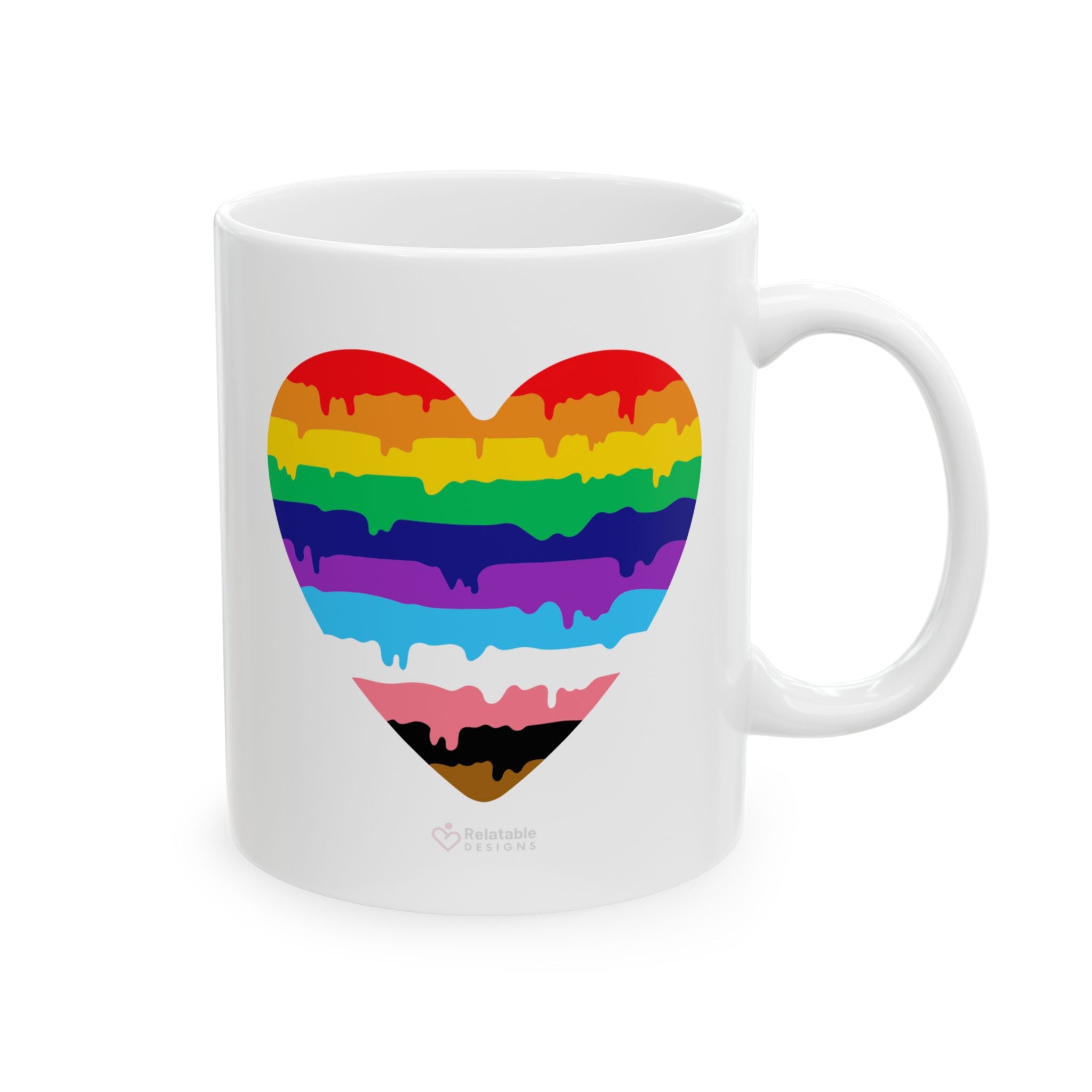 White ceramic mug with LGBTQ rainbow heart design on a white background