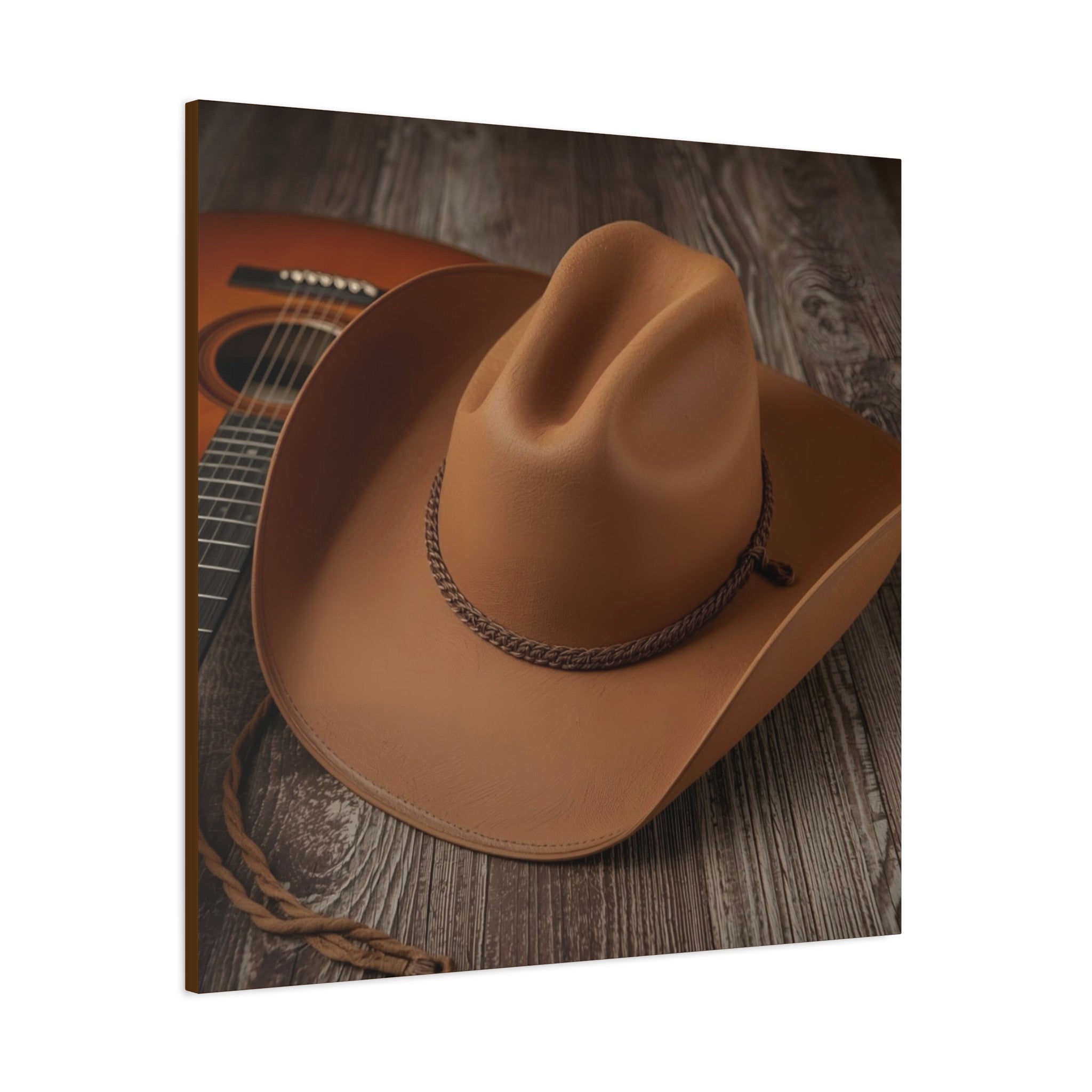 Brown western cowboy hat on a wooden surface with an acoustic guitar.