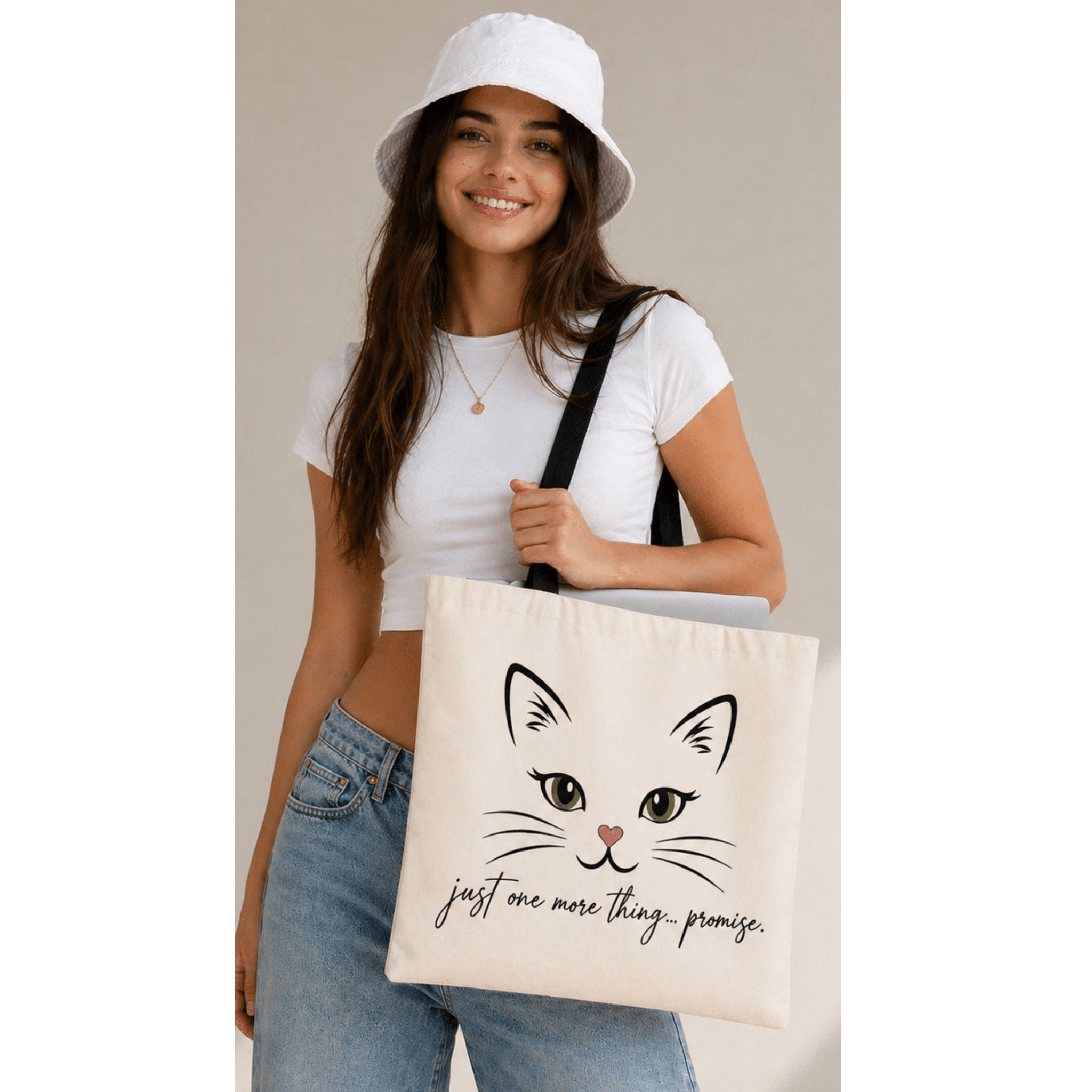 Woman carrying cute cat tote bag with black handles casual outfit