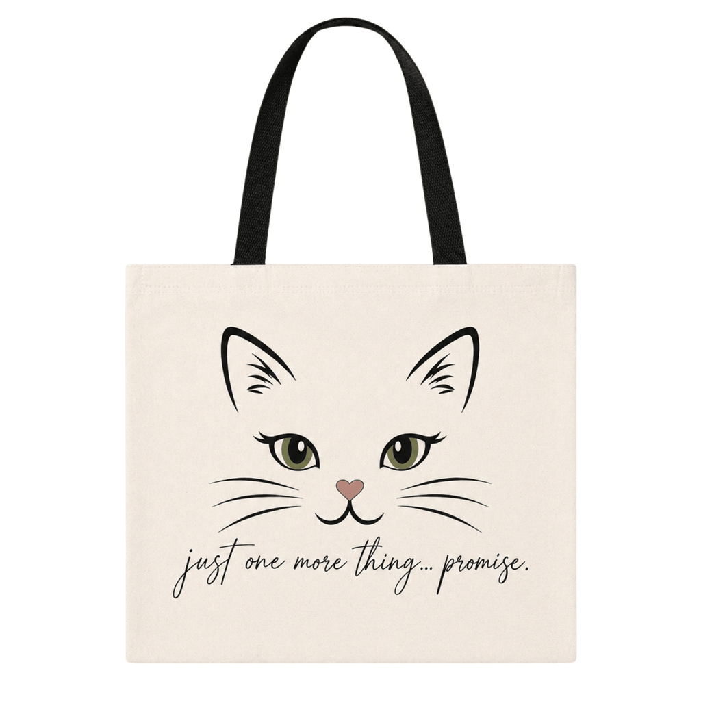 Flat lay tote bag with a cat illustration and text 'just one more thing...promise' on a white background