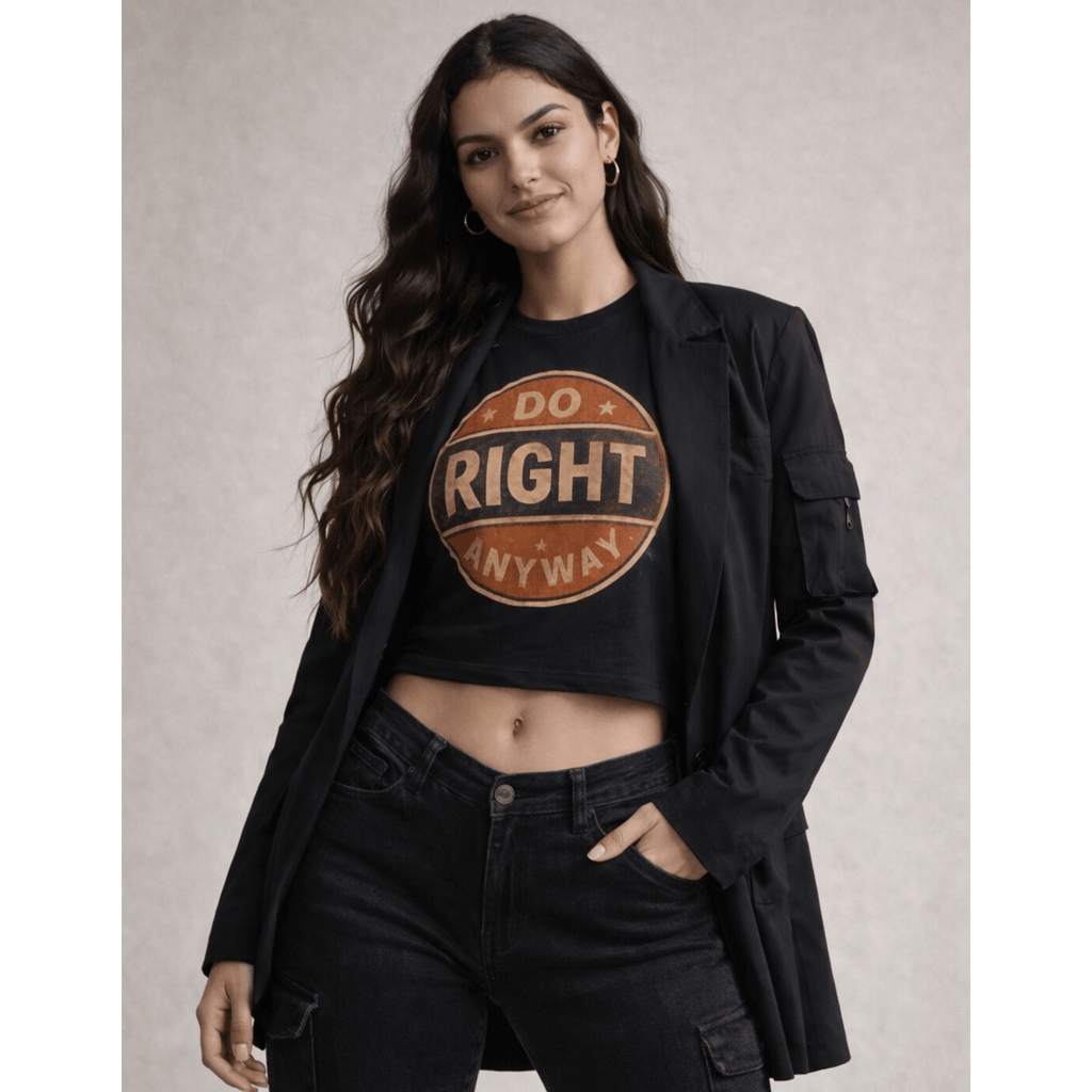 Woman wearing a black crop top with 'Do Right Anyway' text and black pants against a neutral background