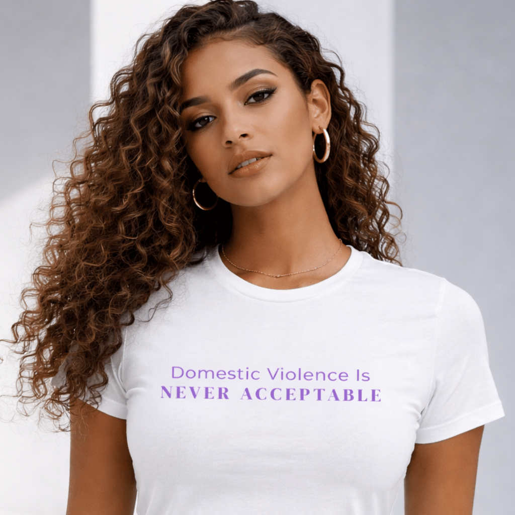 Woman wearing "Domestic Violence Is Never Acceptable" awareness t-shirt, front view lifestyle model by Relatable Designs.