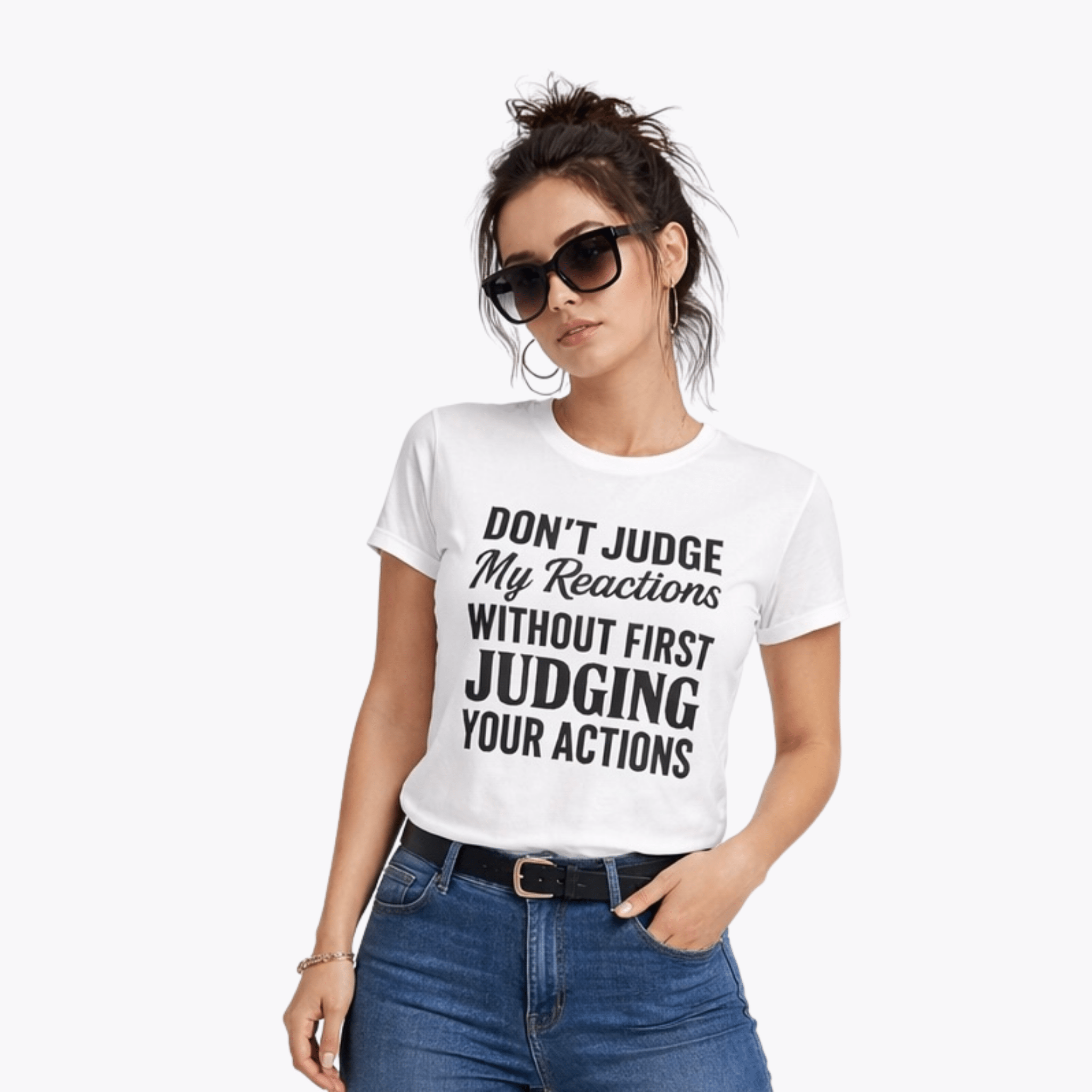 Young woman in white fitted graphic t-shirt with statement quote and sunglasses, styled in denim jeans by Relatable Designs