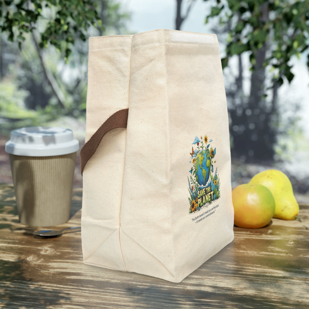 Side view beige tote bag with a design and text, placed outdoors on a wooden surface with a coffee cup and fruits.