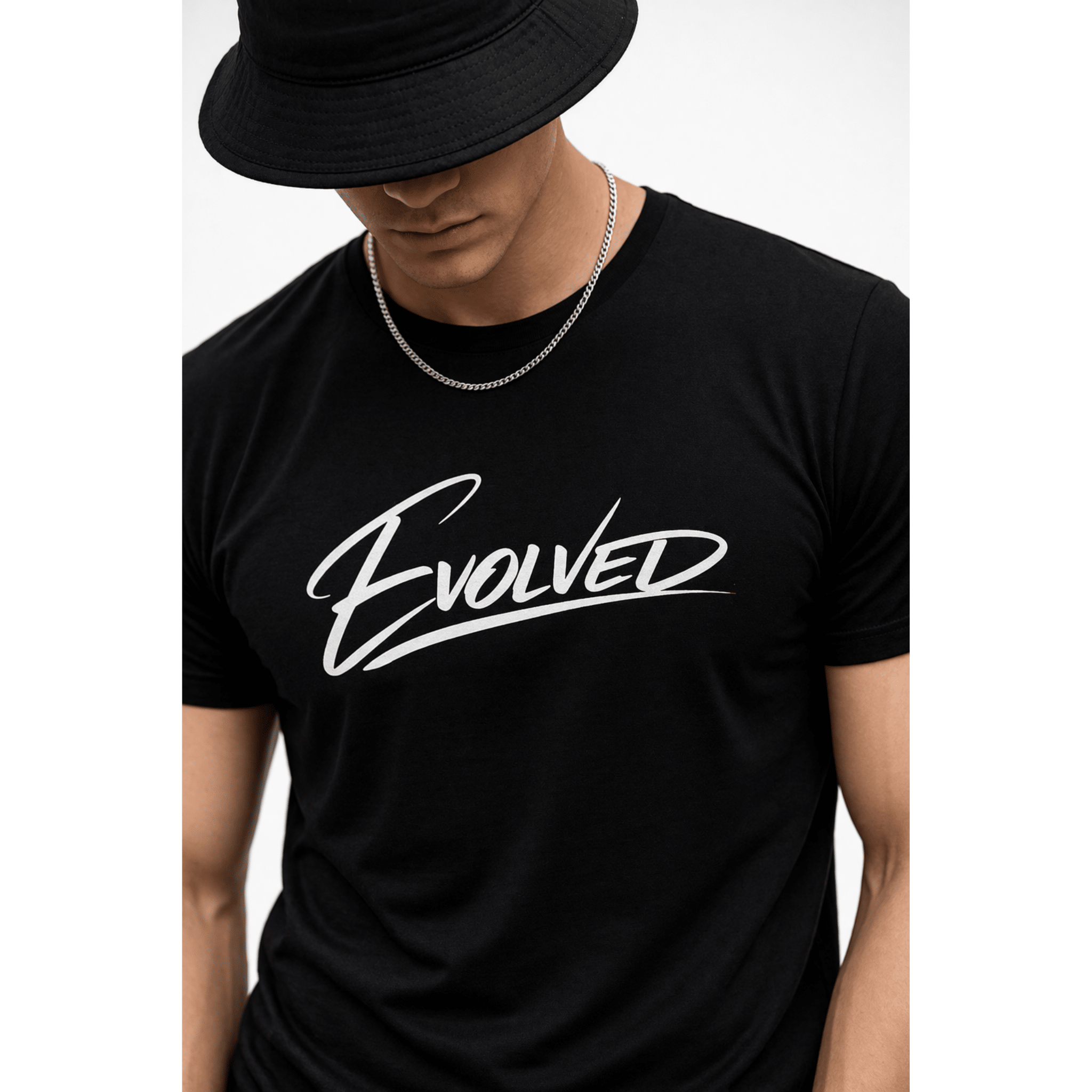 Black "Evolved" text on black tee - close up view on male model, clean minimal fashion styling by Relatable Designs