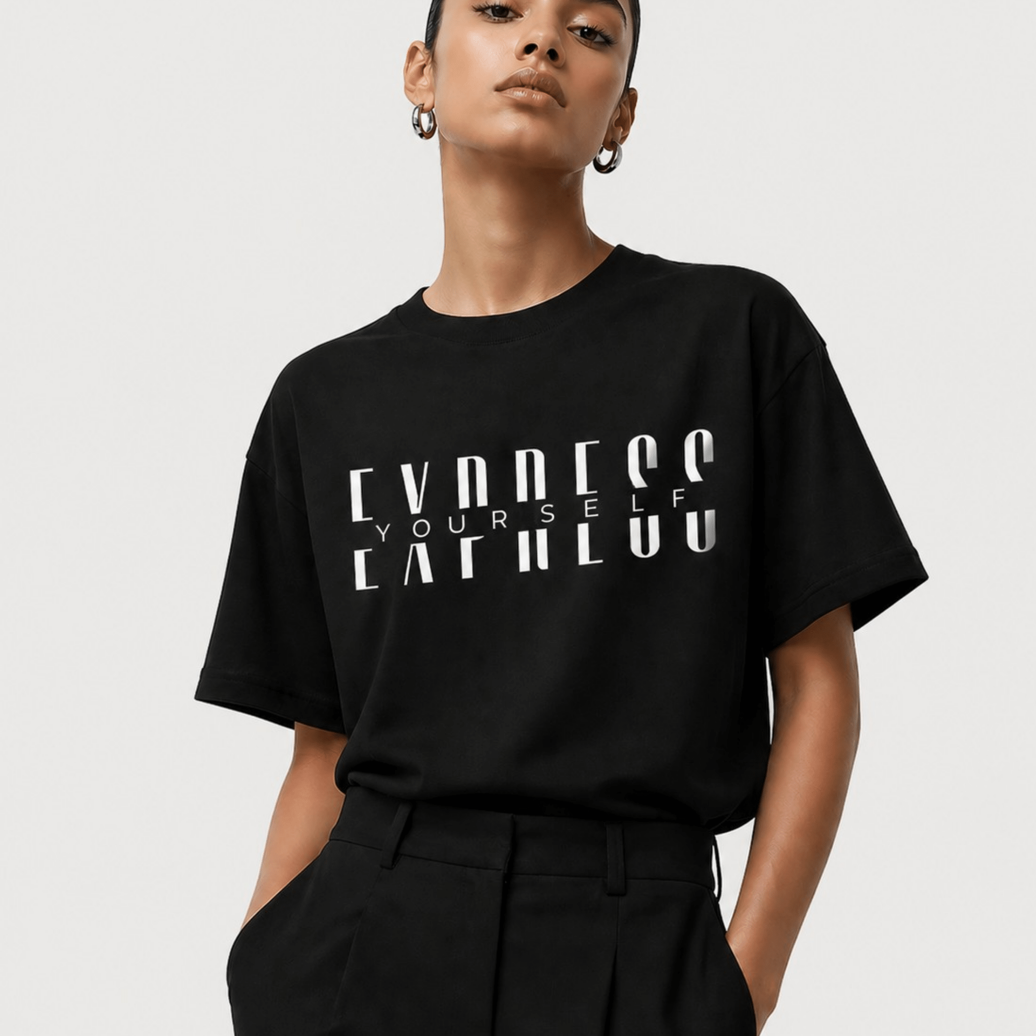 Woman wearing black Express Yourself minimalist graphic tee close-up by Relatable Designs.