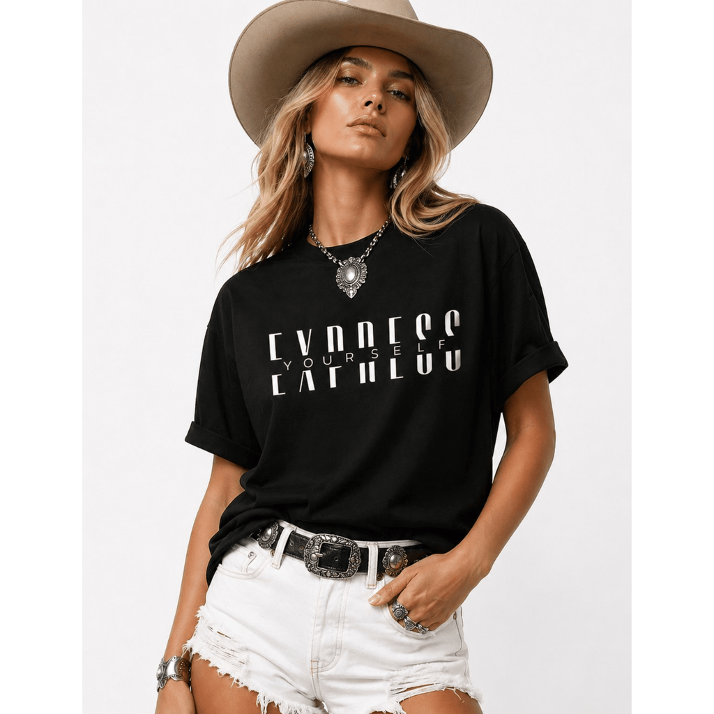 Female model wearing a black t-shirt with text 'Express Yourself', white shorts, and a tan western hat on a light gray background