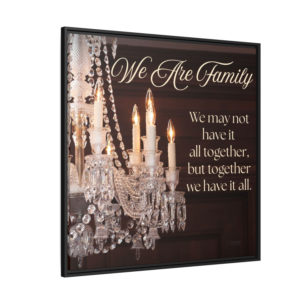 Close-up of “We Are Family” quote on framed canvas with elegant chandelier detail