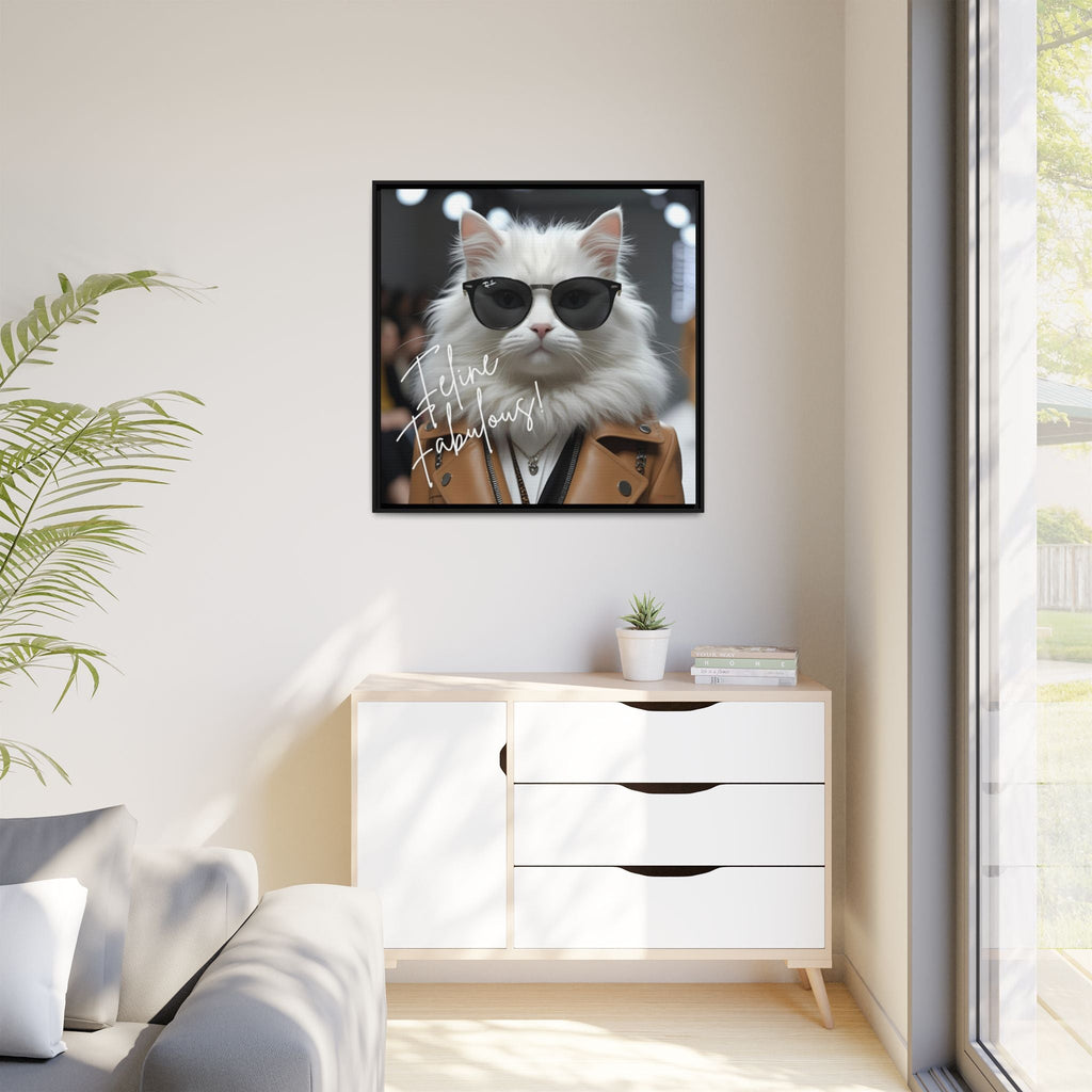 Framed humorous picture of a cat wearing sunglasses on a wall in a modern living room.