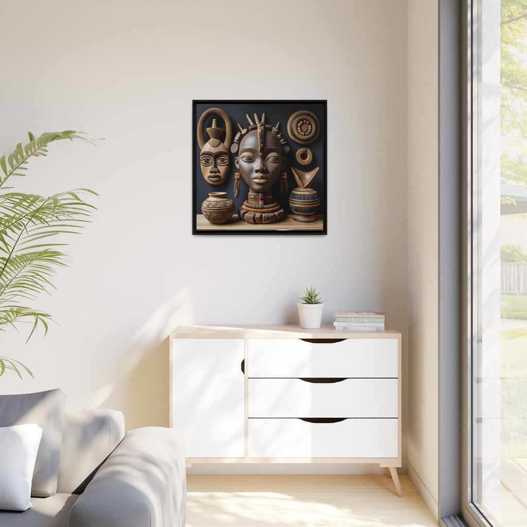 Framed artwork of African artifacts on a wall above a white cabinet with drawers.