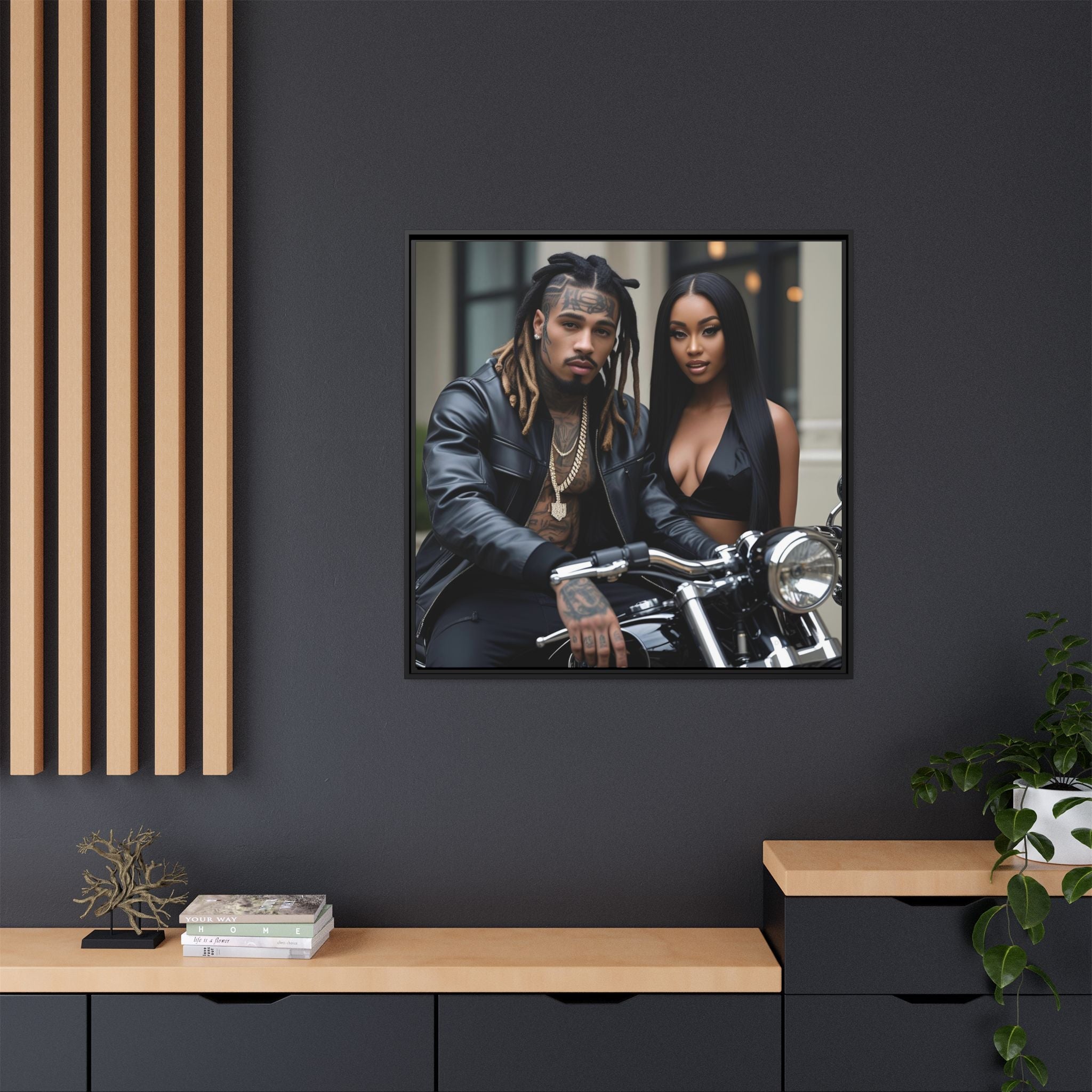 Framed wall art of a man and woman on a motorcycle in a contemporary interior setting.