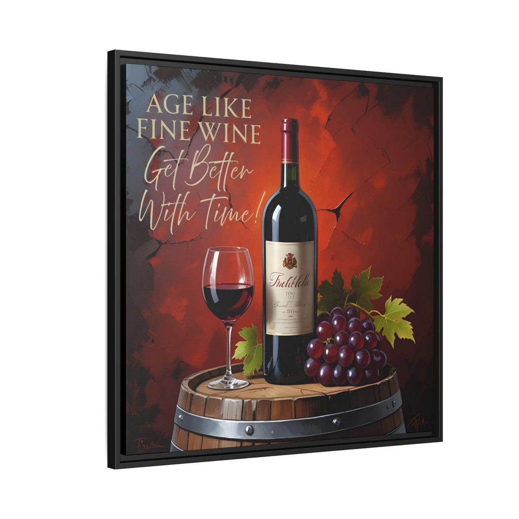 Framed canvas artwork with a bottle of red wine, glass, and grapes on a barrel against a red background with text.