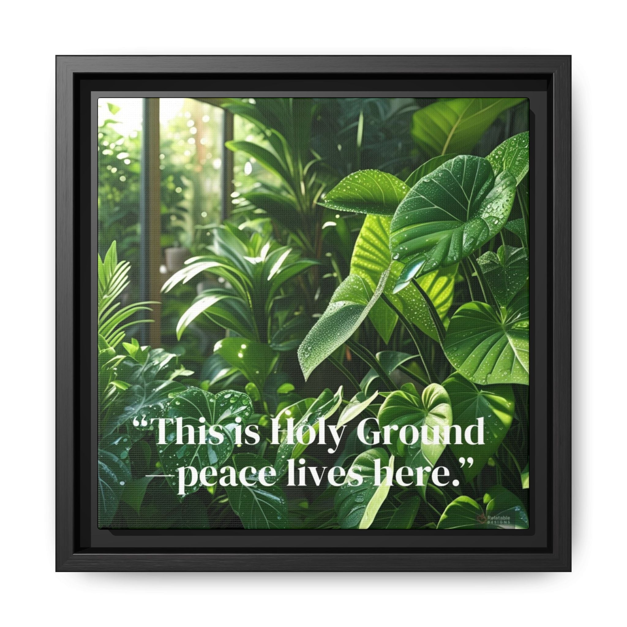 Framed canvas with vibrant lush green foliage and quote - This Is Holy Ground - peace lives here on a white background.