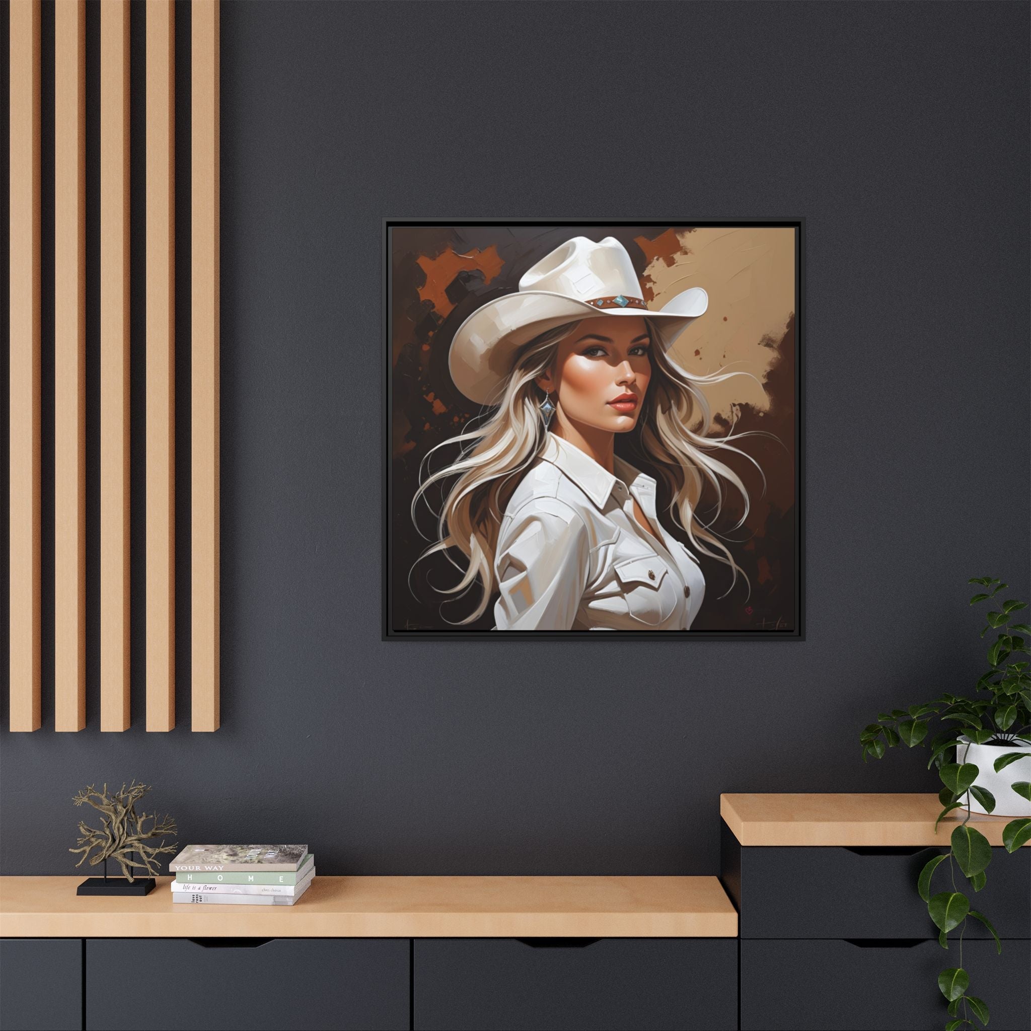 Framed western theme artwork of Texas cowgirl wearing a cowboy hat on a dark wall.
