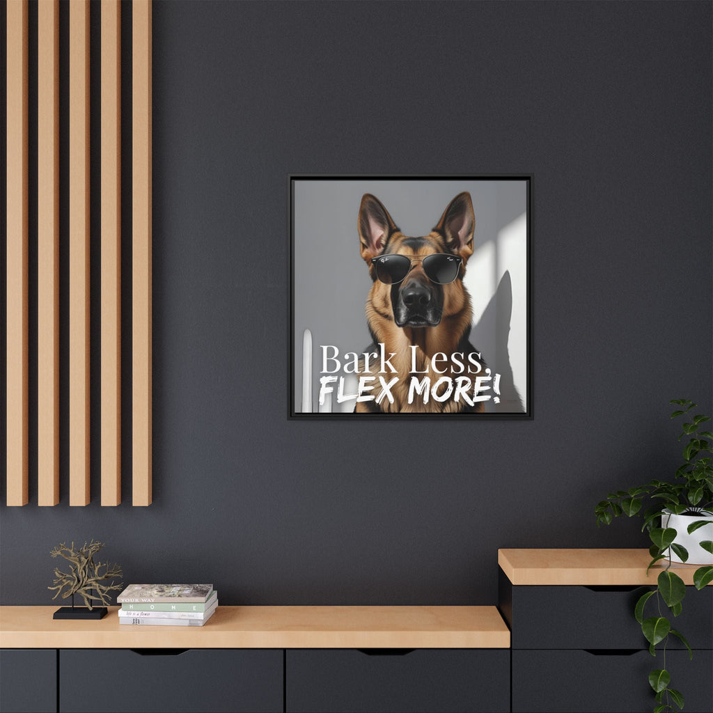 Framed German Shepard wall art with sunglasses and text 'Bark Less, Flex More!' on a dark wall.