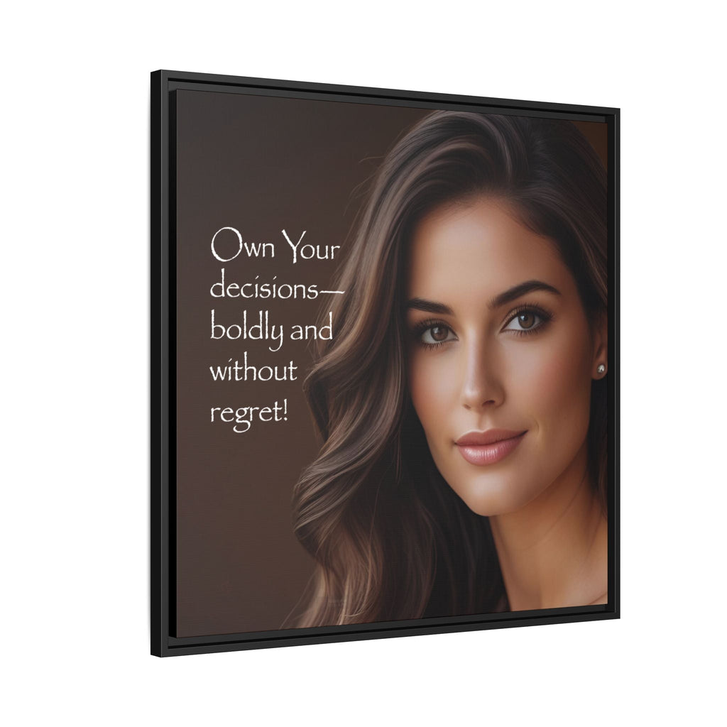 Framed artwork with a woman's face with text 'Own Your decisions-boldly without regret' on a dark background.