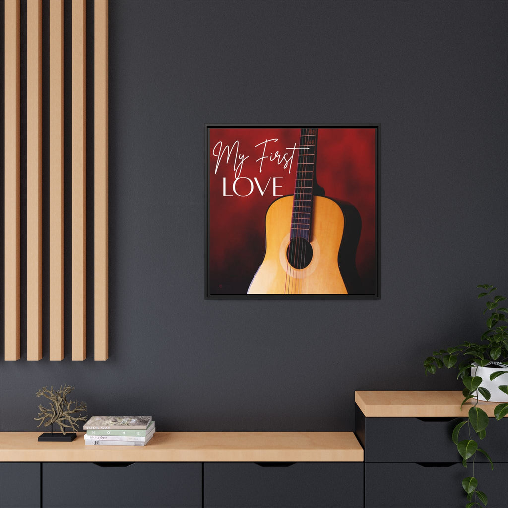 Framed artwork of a guitar with 'My First Love' text on a dark wall.