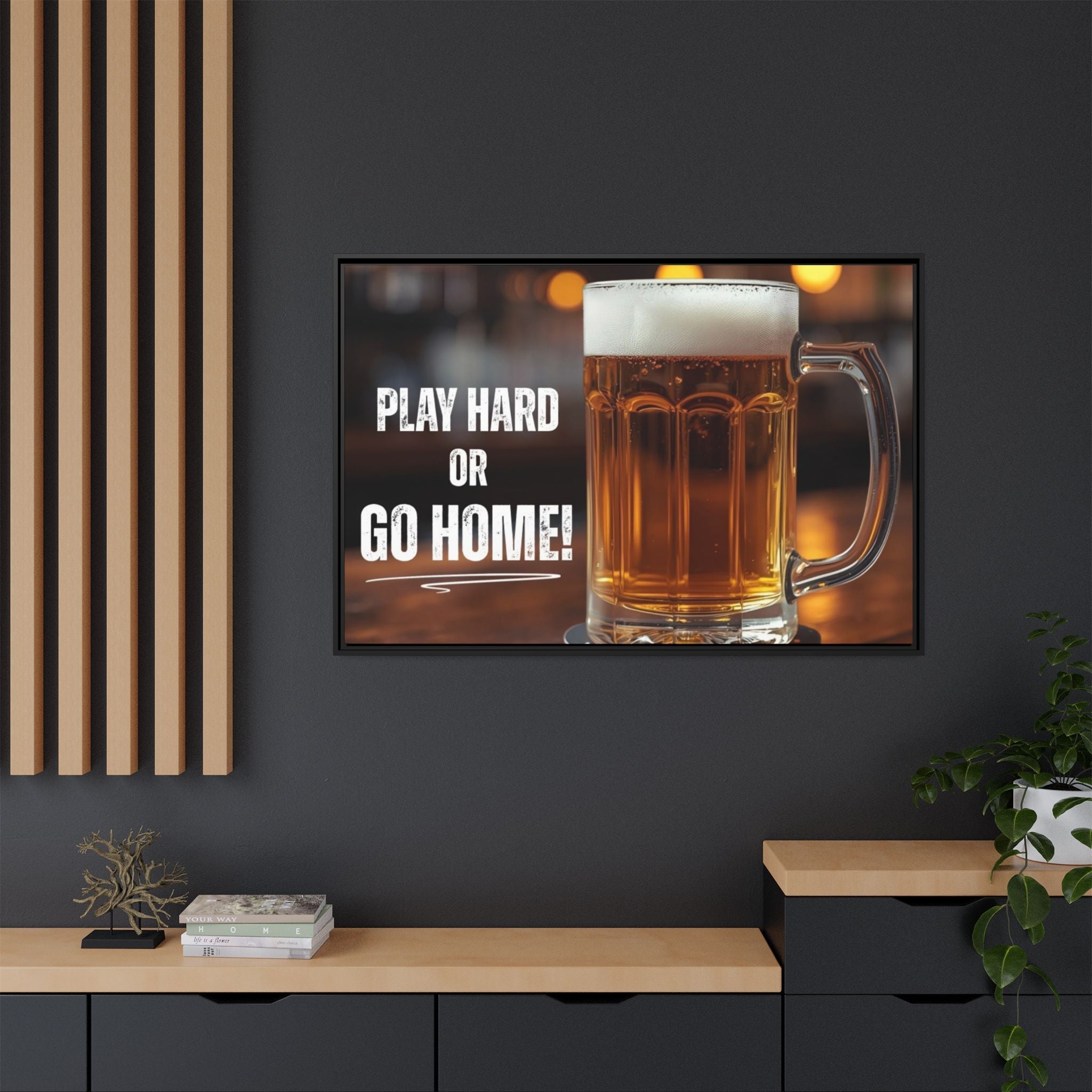 Framed man cave artwork of a beer mug with 'Play Hard or Go Home!' text on a dark wall.
