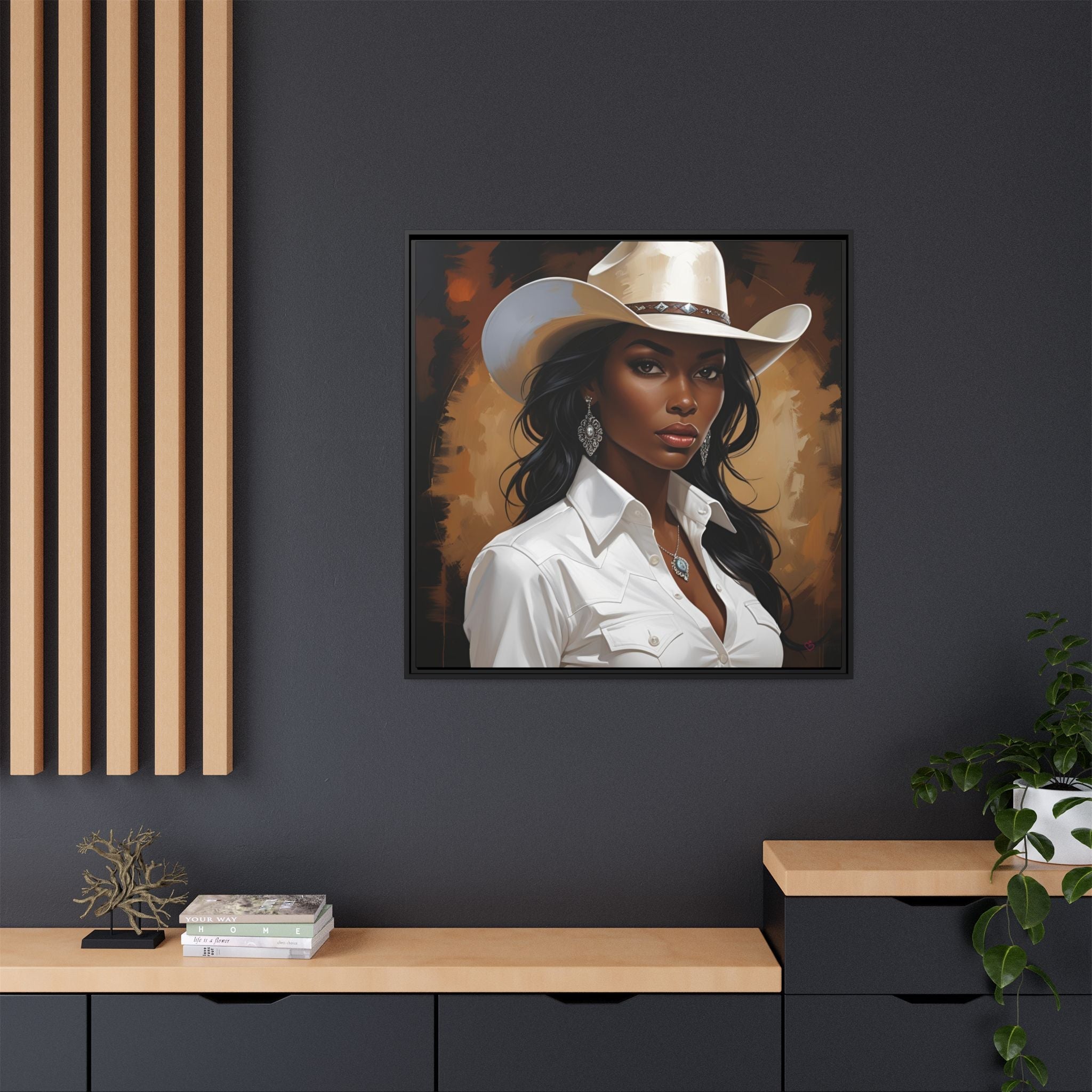 Framed portrait of an African American woman wearing a cowboy hat on a dark wall.