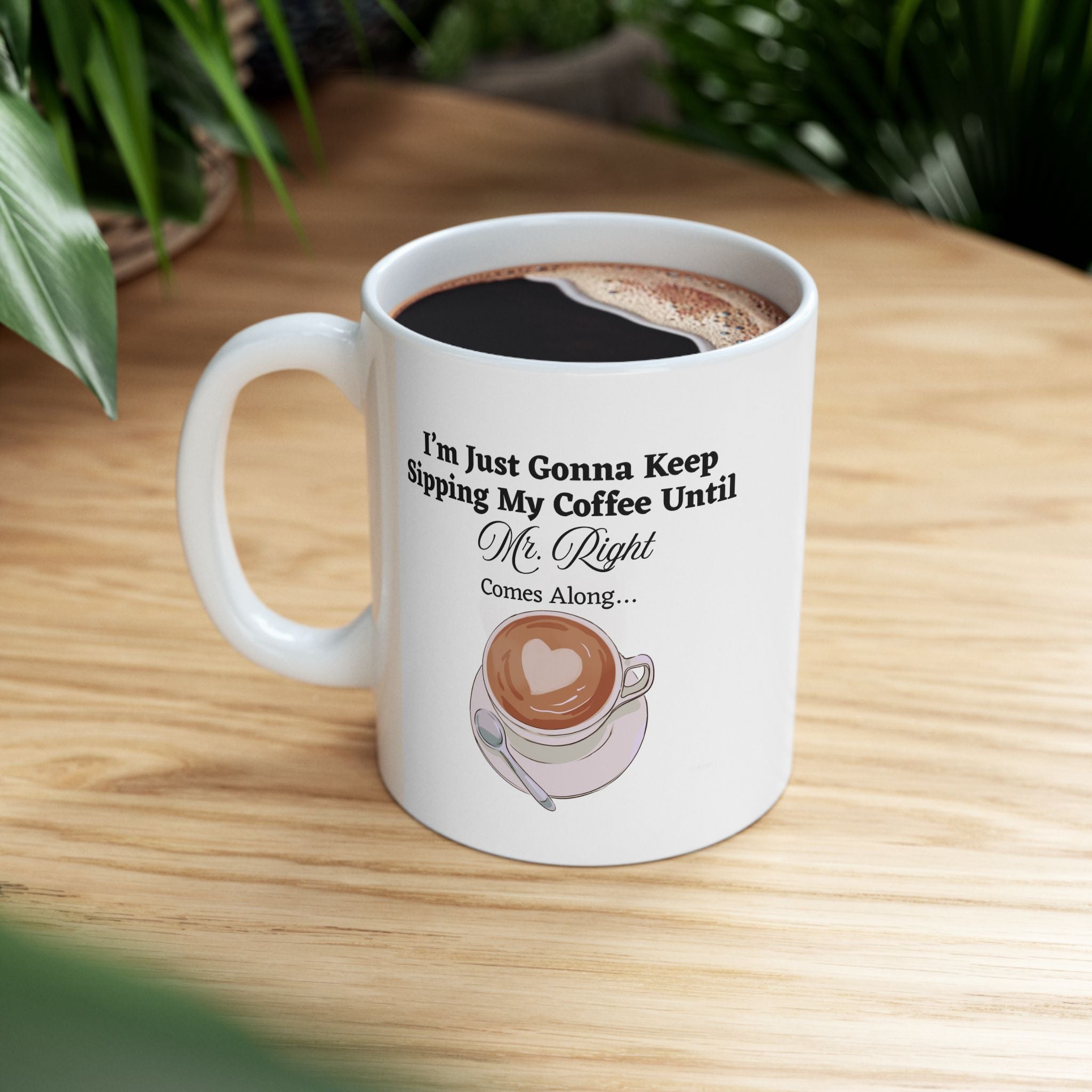 Humorous white coffee mug with Mr. Right quote with coffee design and text on a wooden table