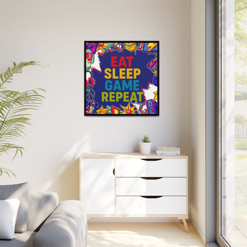 Colorful motivational framed canvas print with 'Eat Sleep Game Repeat' text in a modern living room.