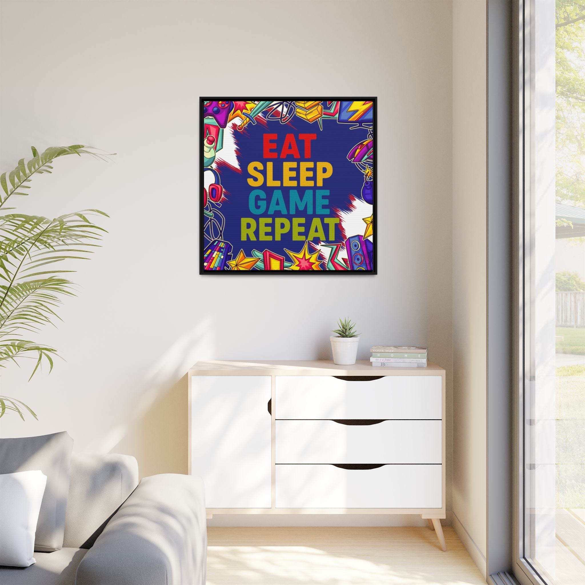 Colorful motivational framed canvas print with 'Eat Sleep Game Repeat' text in a modern living room.
