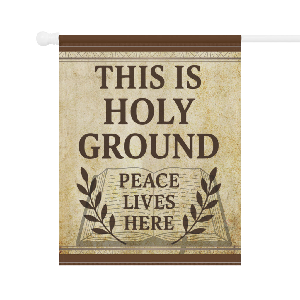 Decorative flag on pole with 'This is Holy Ground, Peace Lives Here' text on a vintage-style background.