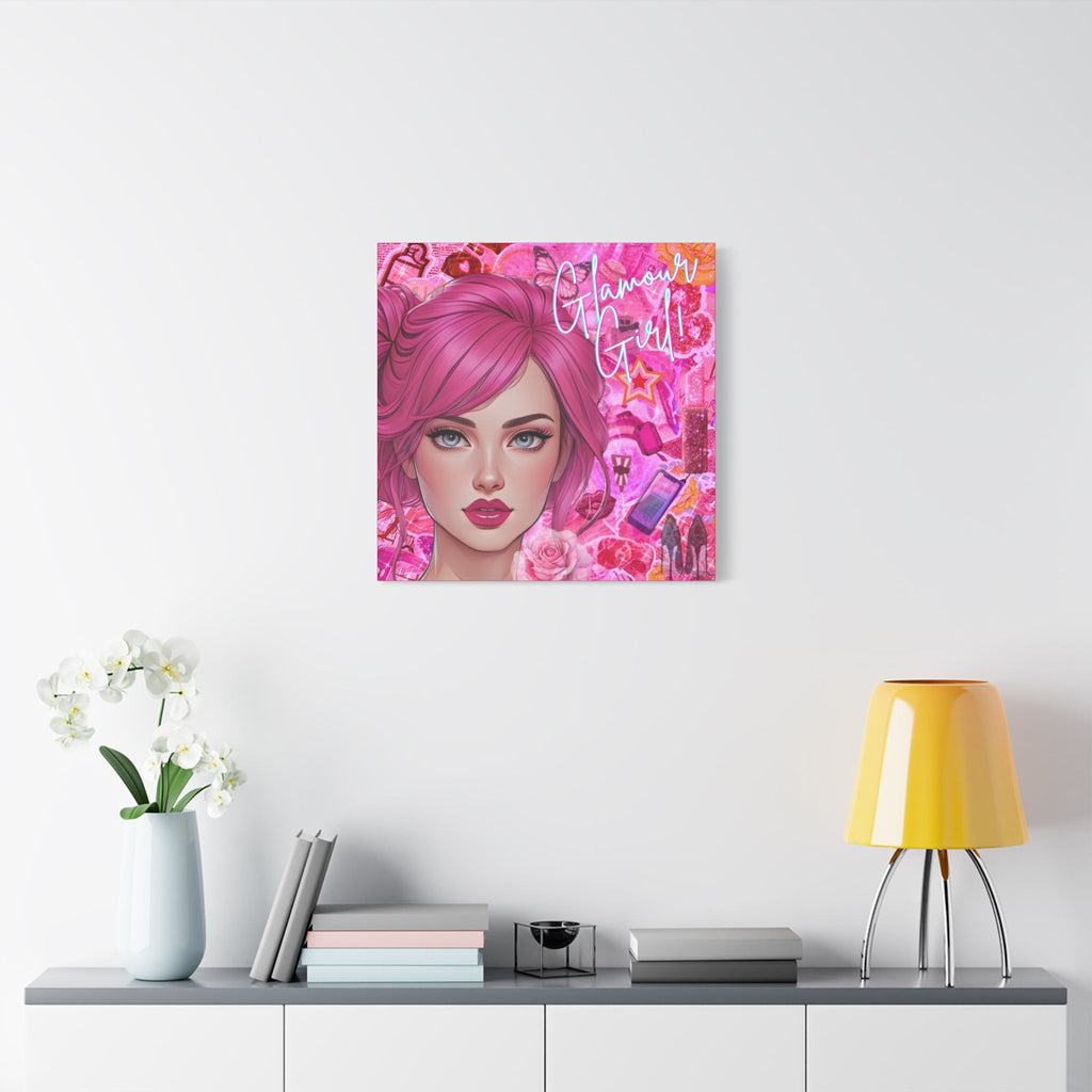 Chic canvas print of a woman with pink hair on a wall above a table with decor items.
