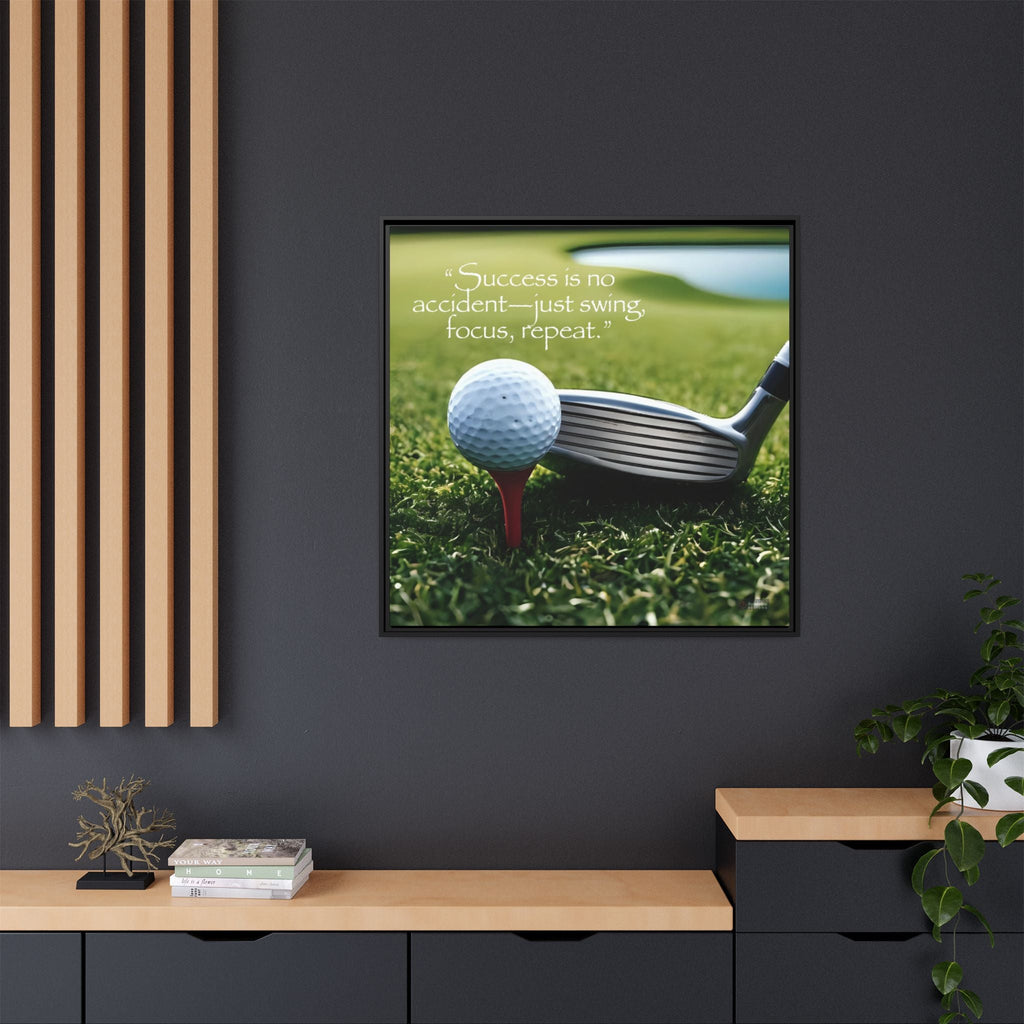 Framed motivation picture of a golf club and ball on grass with quote mounted on a dark wall.
