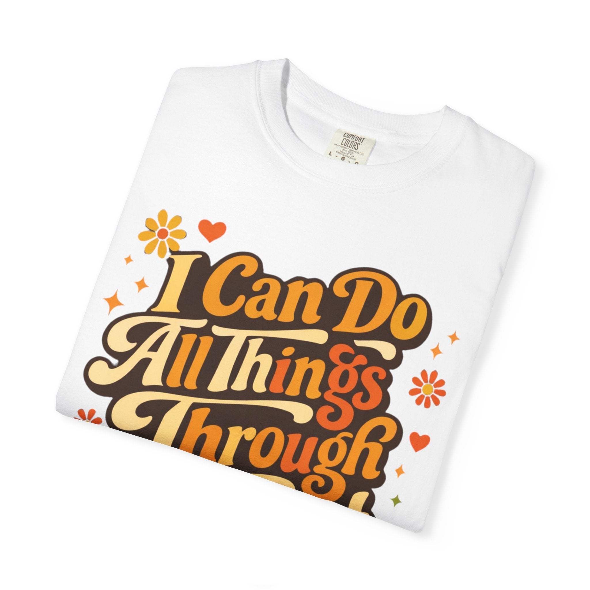 Folded white t-shirt with motivational quote design on a white background
