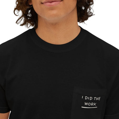 Guy wearing a black t-shirt with 'I DID THE WORK' text on a plain background