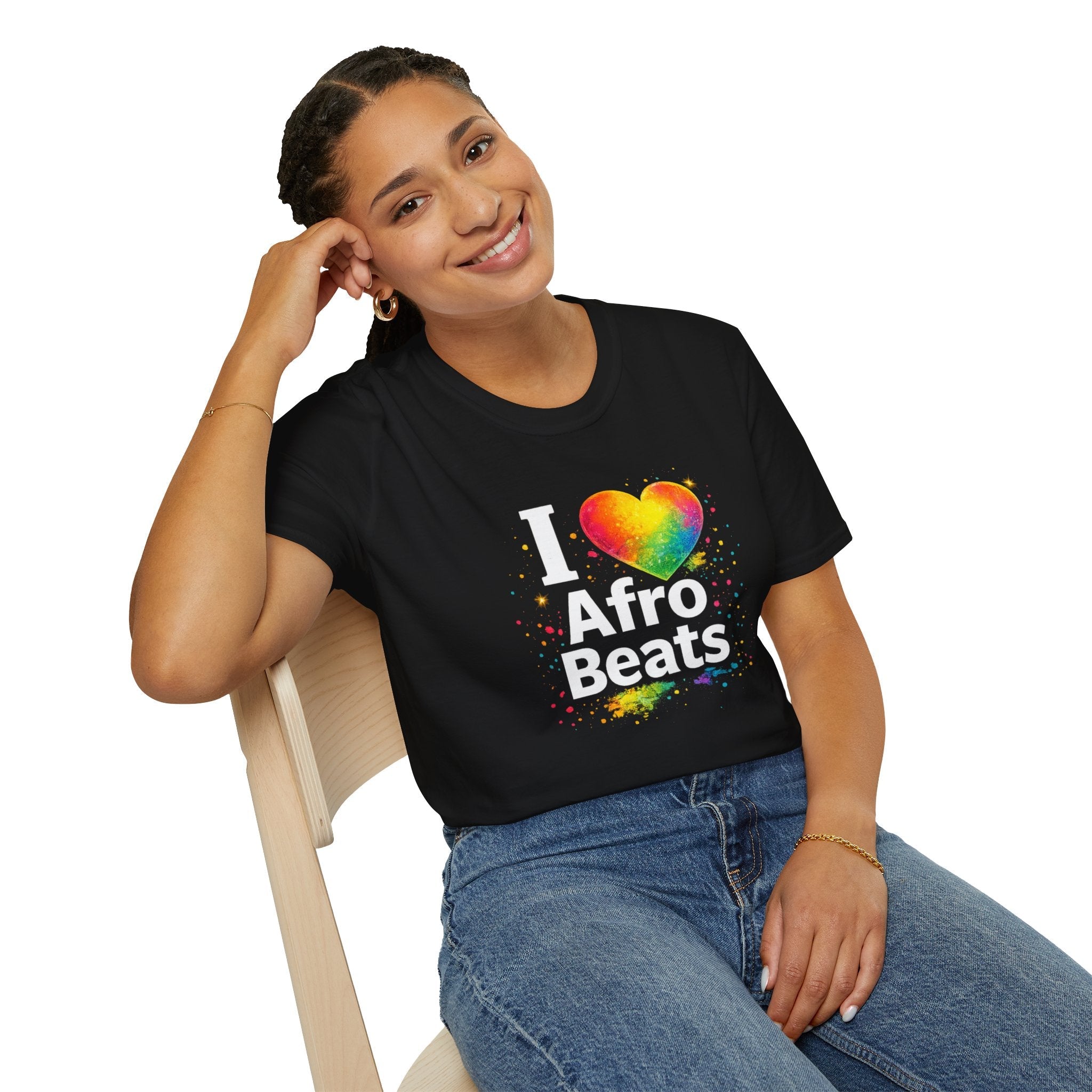 Person wearing a black t-shirt with 'I ❤️ Afro Beats' design, sitting on a chair.