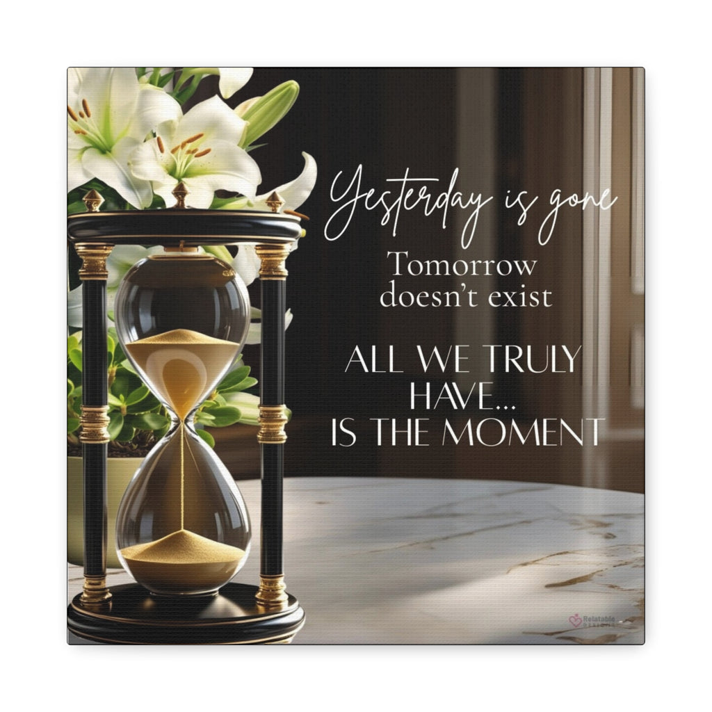Hourglass with flowers and motivational quote on a marble surface by Relatable Designs.