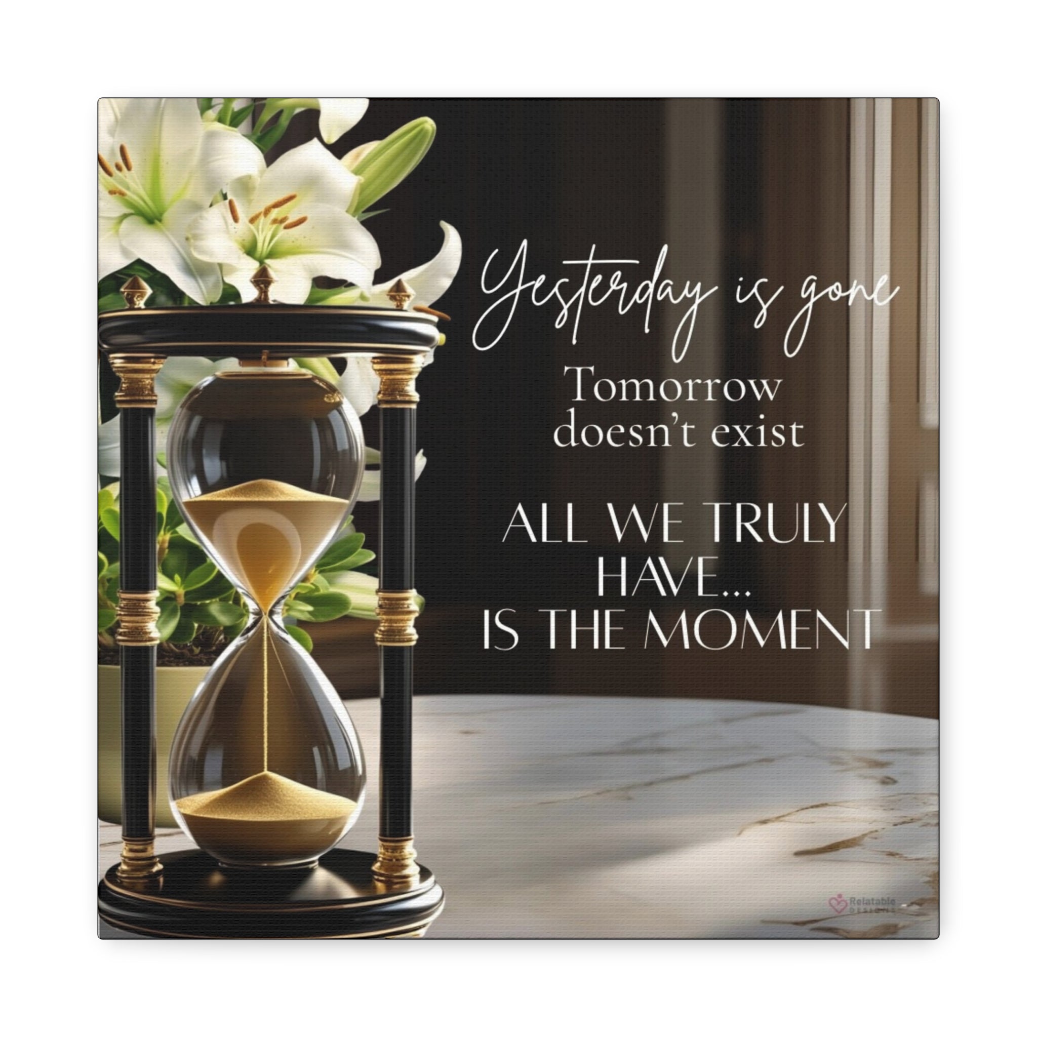 Hourglass with flowers and motivational quote on a marble surface by Relatable Designs.