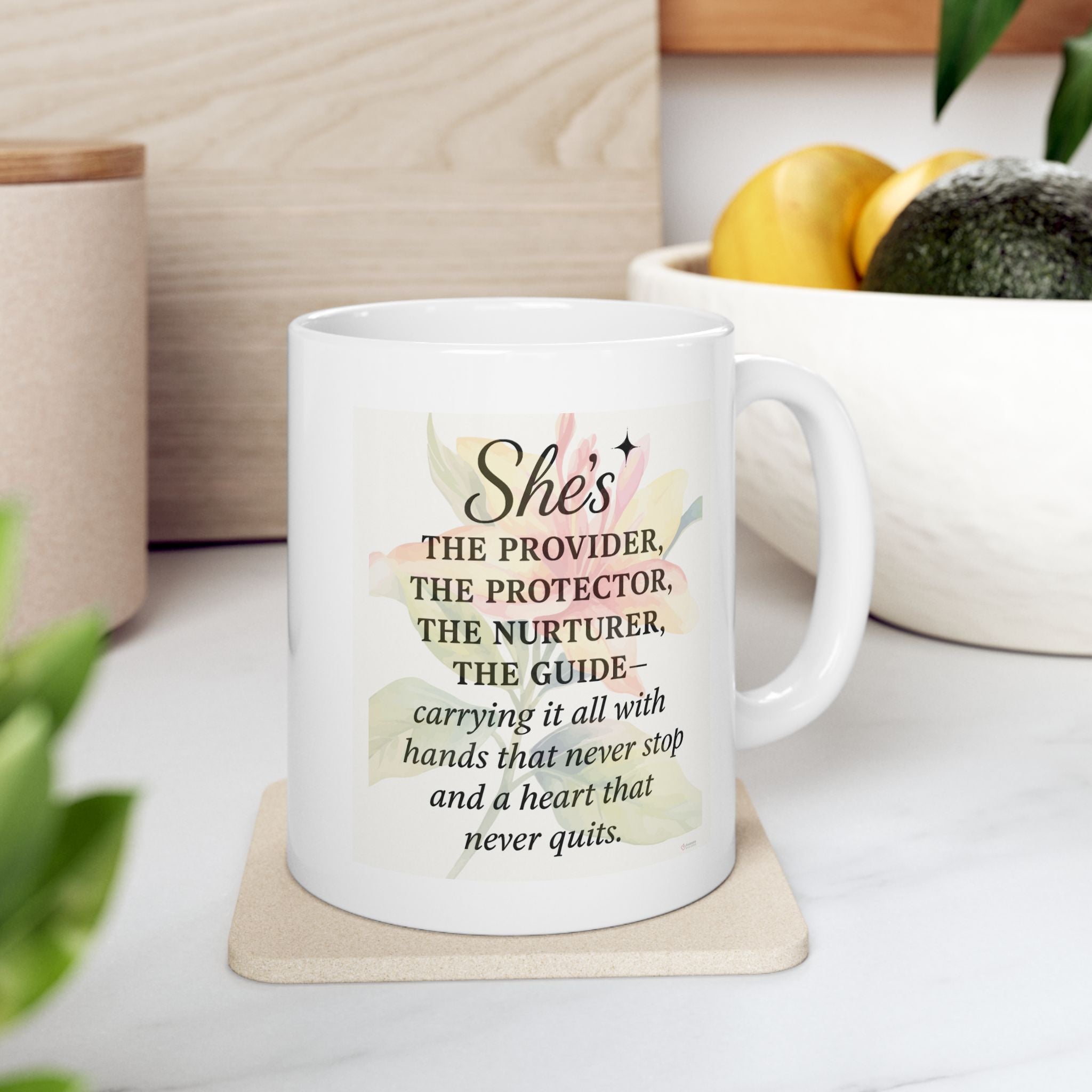 White mug with motivational quote on a coaster, placed on a kitchen countertop 