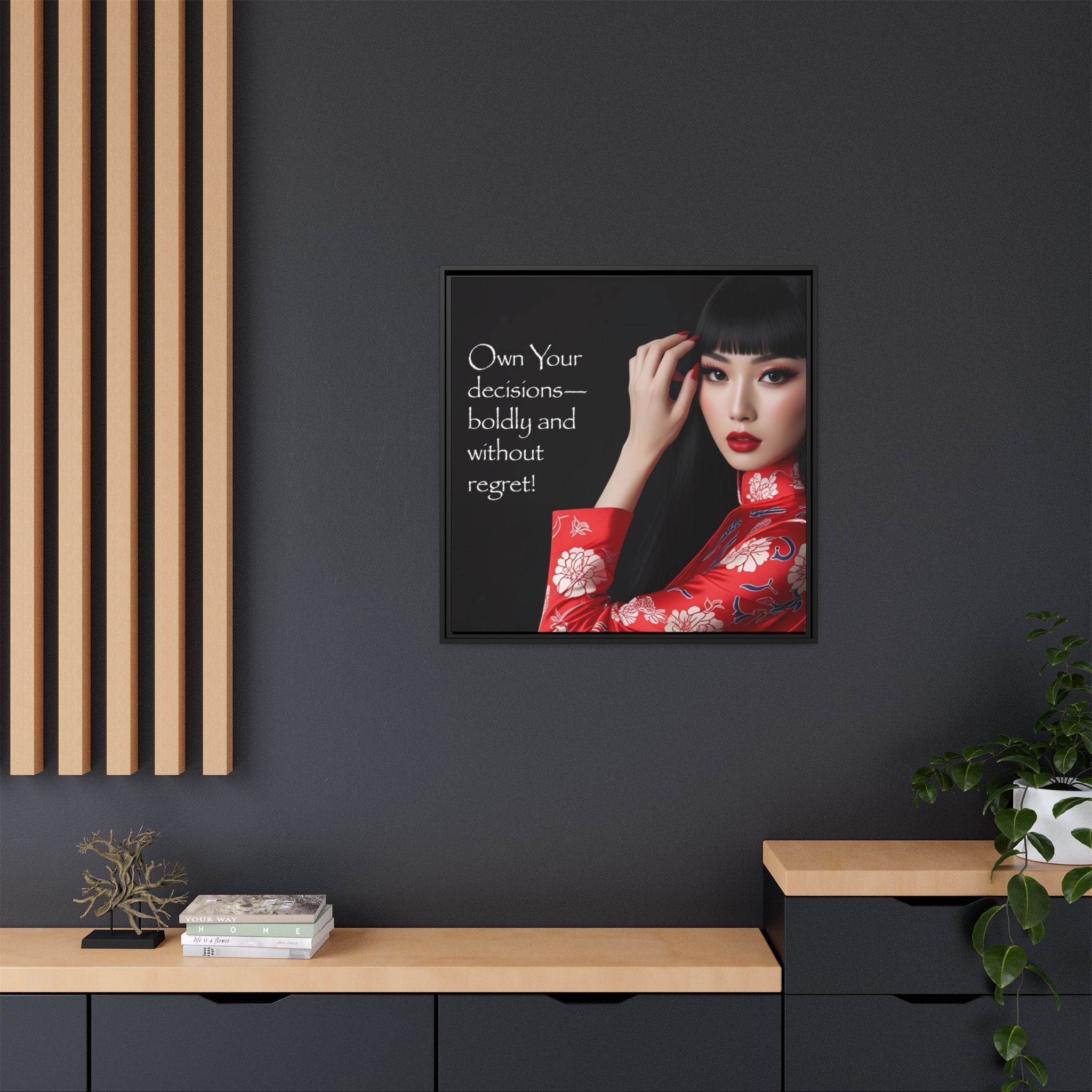 Framed artwork with a quote on a dark wall, featuring a woman in a red outfit.